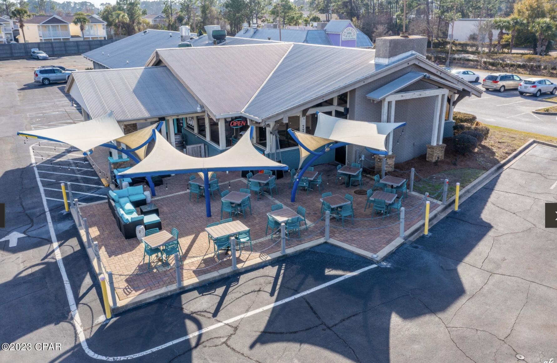 Turnkey restaurant for sale!! Fully Equipped with seating of 250 with a private dinning room for all banquets and functions, has 3 walkin coolers, 67 tap beers and a brand new pizza oven plus every other commercial equipment a restaurant will dream of. This restaurant has successfully operated the restaurant for 25 years. Great opportunity! Property is zoned C-3and is 1.87 acres with 225 ft frontage on Front Beach. Close to new PCB Sports Complex. Site can also be used for retail and would also lend itself for redevelopment as hotel/motel space. 52000 traffic count. Building has been well maintained for future owners. the sale includes two parcels 	27874-010-000 and 27874-015-000