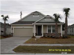 Beautiful new construction home in the new Whisper Dunes Phase 2B Subdivision. The home has a Cobia floor plan with a Coastal Elevation. A Samuel Taylor built home includes standard features such as designer carpet in main areas and bedrooms, 8 ft. 2 panel craftsman interior door package, brushed nickel fixtures and faucets throughout, insulated (R19) interior common walls and insulated (R38) ceilings, and durable Sherwin Williams premium interior wall paint. Kitchen features stainless steel appliance package (range, dishwasher, & microwave) and oversized 36'' wood cabinetry with crown molding, and granite counter tops. Full bathrooms include raised vanity heights, large tile flooring in bathrooms and laundry rooms, 2 x 6 Exterior Wall Construction, and hurricane tie down rod