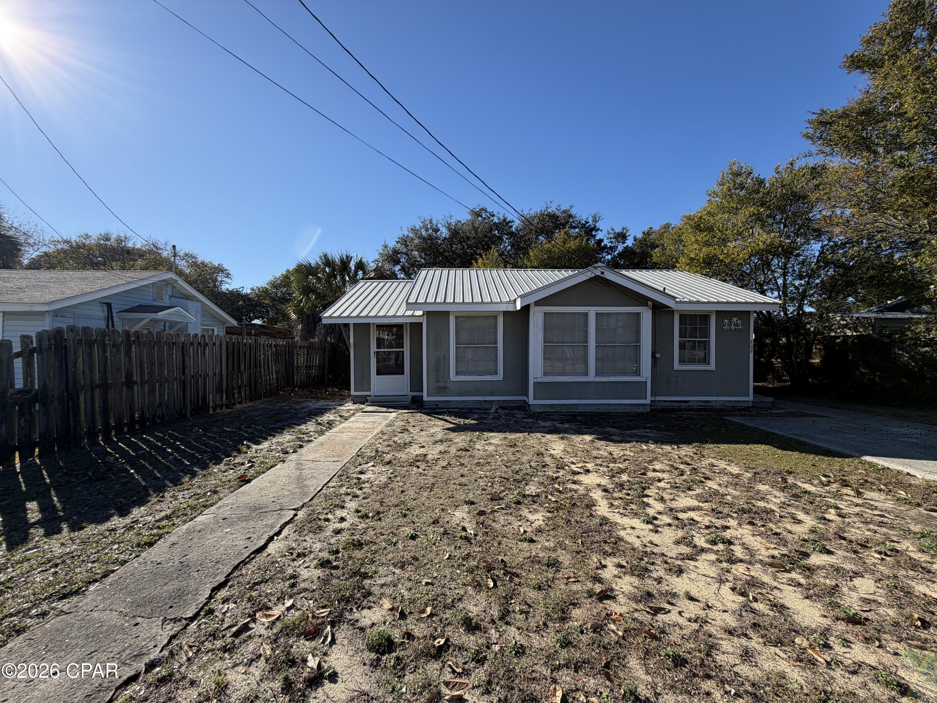 'CURRENTLY UNDER CONTRACT, SELLER WILL CONSIDER BACKUP OFFERS'

Florida Cottage situated on a nice size lot and a short walk or Golf cart ride to the beach.
Charming Florida Cottage with Metal Roof on Fenced Lot with Mature Oak

This Florida cottage offers comfortable single-story living with a functional layout and coastal character. Situated on a 56 x 120 lot, the property features a fully fenced backyard, highlighted by a beautiful mature oak tree and a storage building for added convenience.
The home includes a durable metal roof, an inviting covered front entry, and driveway parking. Inside, you'll find an open living and dining area filled with natural light thru the original wood framed windows, accented by neutral coastal tones and built-in shelving. The kitchen offers ample cabinetry, a window over the sink, and adjacent dining space.

The home provides two bedrooms with windows on multiple sides and 1 bathroom, with a walk-in shower. Seller has a the side Florida room setup as a 3rd bedroom. Additional features include window A/C units, ceiling fans, original Pine Wood floors throughout. Located in an established neighborhood with easy access to shopping, dining, and local amenities. Property is being sold As-Is.



Buyer to verify all information deemed important.