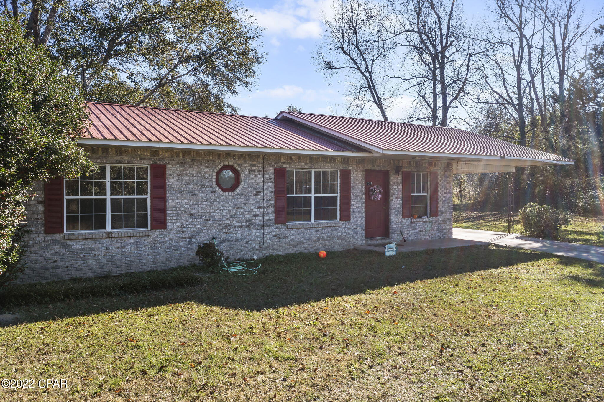 Brick home situated on an acre located just off of Orange Hill Road.  Living area is open to dining area.  Kitchen features a nice amount of cabinets.  Master bedroom has a walk in closet and attached bath. Home has a metal roof and attached carport.