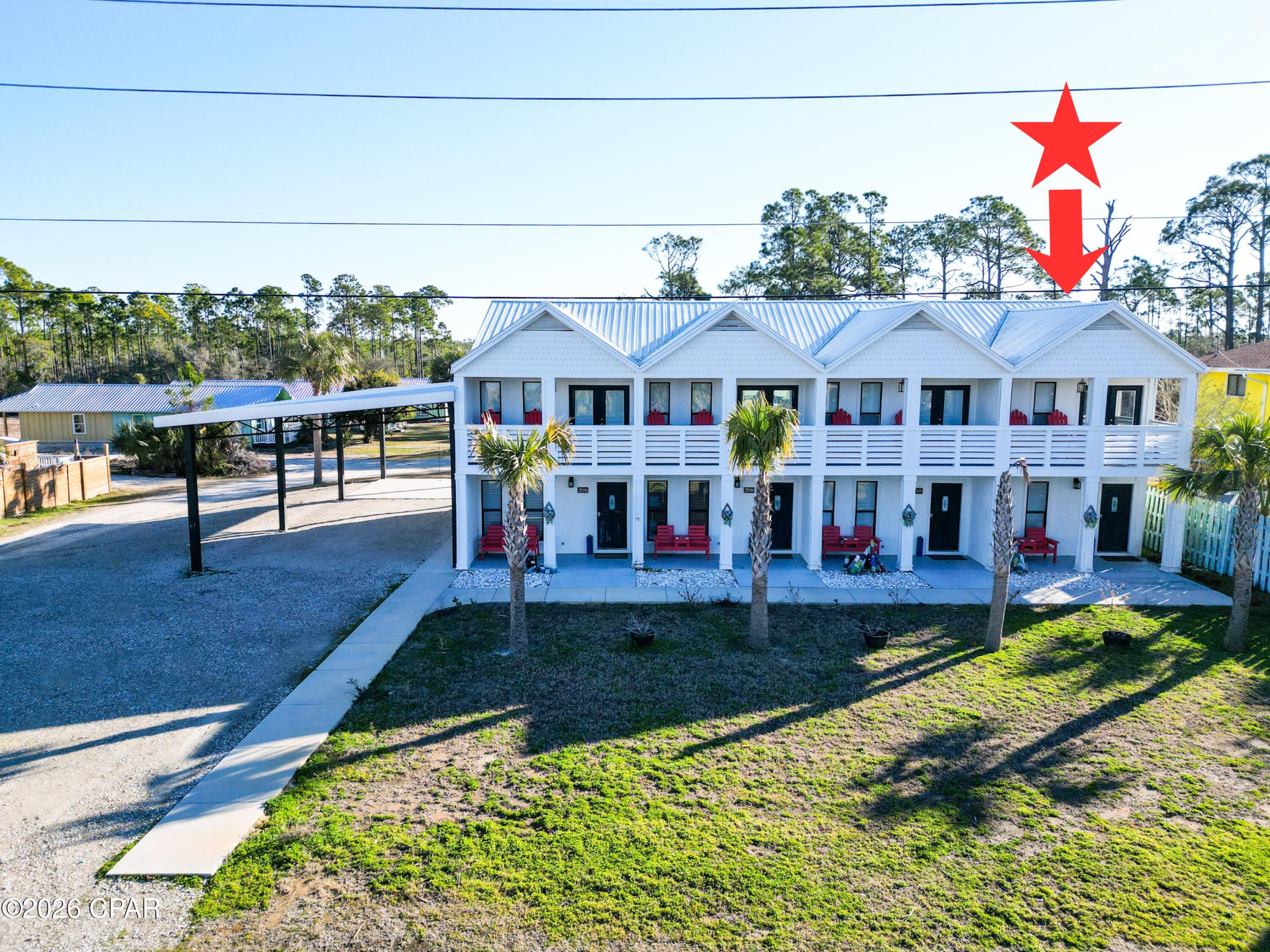 Turn key unit is part of a quadplex across the street from the Gulf of America. Each unit is a 2 bedroom 1 full and 1/2 bath with an open floor plan and gulf views. These completely furnished units have a covered front porch, second story covered deck off of a top bedroom with Gulf of America views. Need to entertain or just want extra space? There is a spacious back patio that is partitioned for privacy, large back yard, and side covered parking gives the property many options for added features or expansion versus similar beach multi unit residences. There is a recorded beach access pedestrian easement for easy beach access right across the street. Conveniently located equidistant between Port St Joe and Mexico Beach for a variety entertainment options. The subdivision is decades old and has its own ingress and egress road with no thru traffic. NO HOA!! All units are in an X flood zone per the Gulf PA website, Verify if important. Some dimensions taken from the Gulf County Property Appraiser's website, please verify if important.