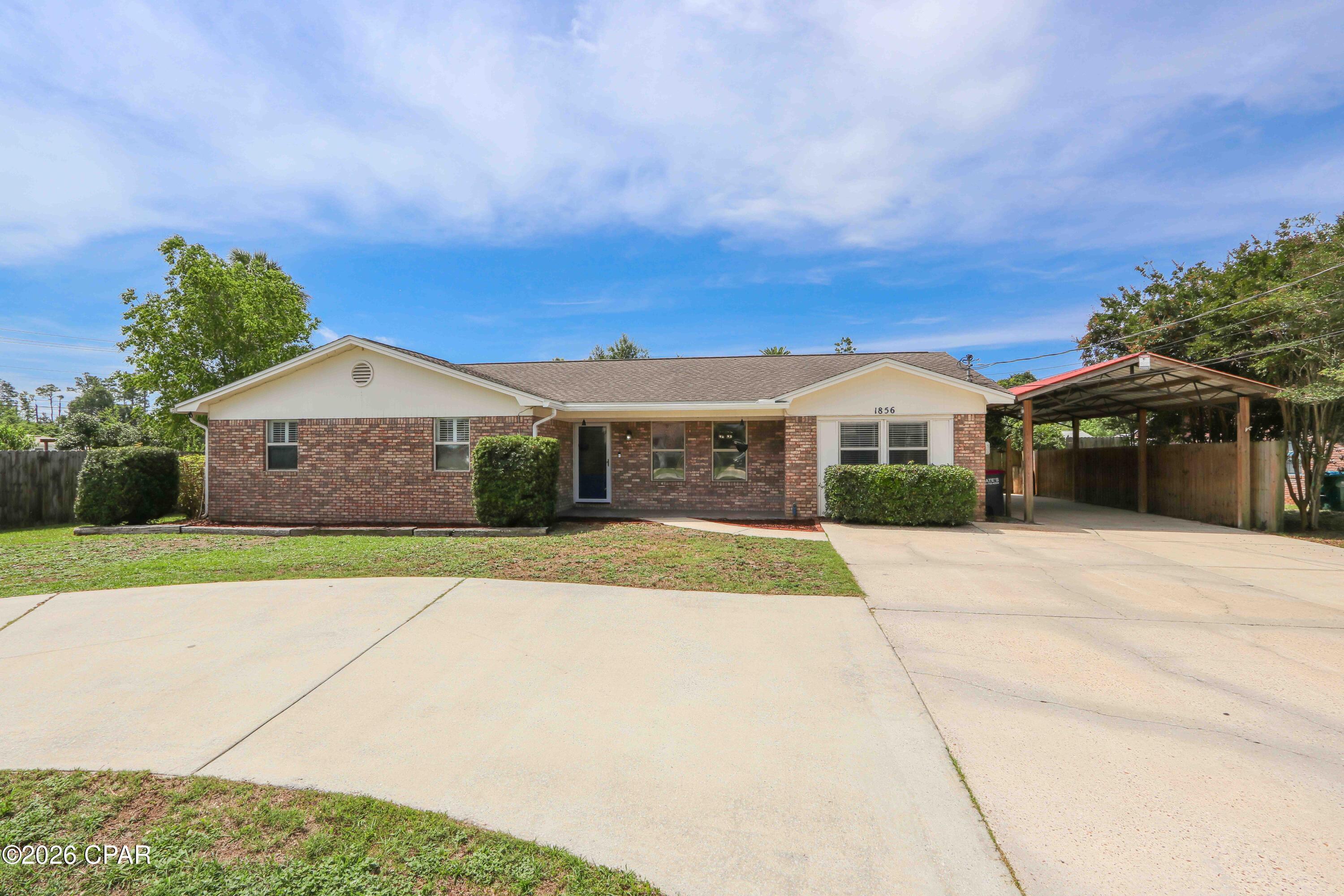 Property Video Available! No HOA, short-term rental permitted, golf-cart access privileges into SweetBay, and less than 10 minutes from Panama City Beach. This is the best value play near SweetBay! Located in a quiet, low-traffic neighborhood in unincorporated Panama City, this property offers a lifestyle that's becoming increasingly difficult to find. Residents in this area can legally drive a street-legal golf cart directly to SweetBay's restaurants, waterfront gathering spaces, parks, events, and popular Sunday farmers market. All without crossing major highways.

This spacious 4-bedroom, 3-bath home offers approximately 2,042 square feet of living space on a fully fenced lot with room to spread out. Inside, you'll find fresh paint in select areas, durable flooring, newer kitchen appliances including the oven and dishwasher, and a flexible floor plan designed for a variety of living arrangements. A separate den with fireplace provides additional living space, while the converted garage serves as a private fourth bedroom suite complete with its own full bathroom. Perfect for guests, multi-generational living, a home office, or hobby space.
Outside, the property is built for functionality and convenience. The circular driveway provides ample parking, while the approximately 14' x 38' covered carport with lighting offers excellent space for a boat, small RV, trailers, workshop use, or additional vehicle storage. Additional features include a covered back patio, storage building, and reinforced gates providing easy access throughout the property.
The location places you just minutes from the rapidly expanding SweetBay Town Center, anchored by Publix and surrounded by growing retail, dining, recreation, and future development. University Academy, hospitals, shopping, Lynn Haven, Panama City, and the beaches are all nearby, making this a prime location for a primary residence, second home, or investment property.


Qualified buyers may also have the opportunity to assume the seller's existing VA loan with an interest rate of just 2.5%, offering a potentially significant financing advantage in today's market.


All information is deemed reliable but not guaranteed. Buyer to independently verify all measurements, features, zoning, intended uses, and any information deemed important.