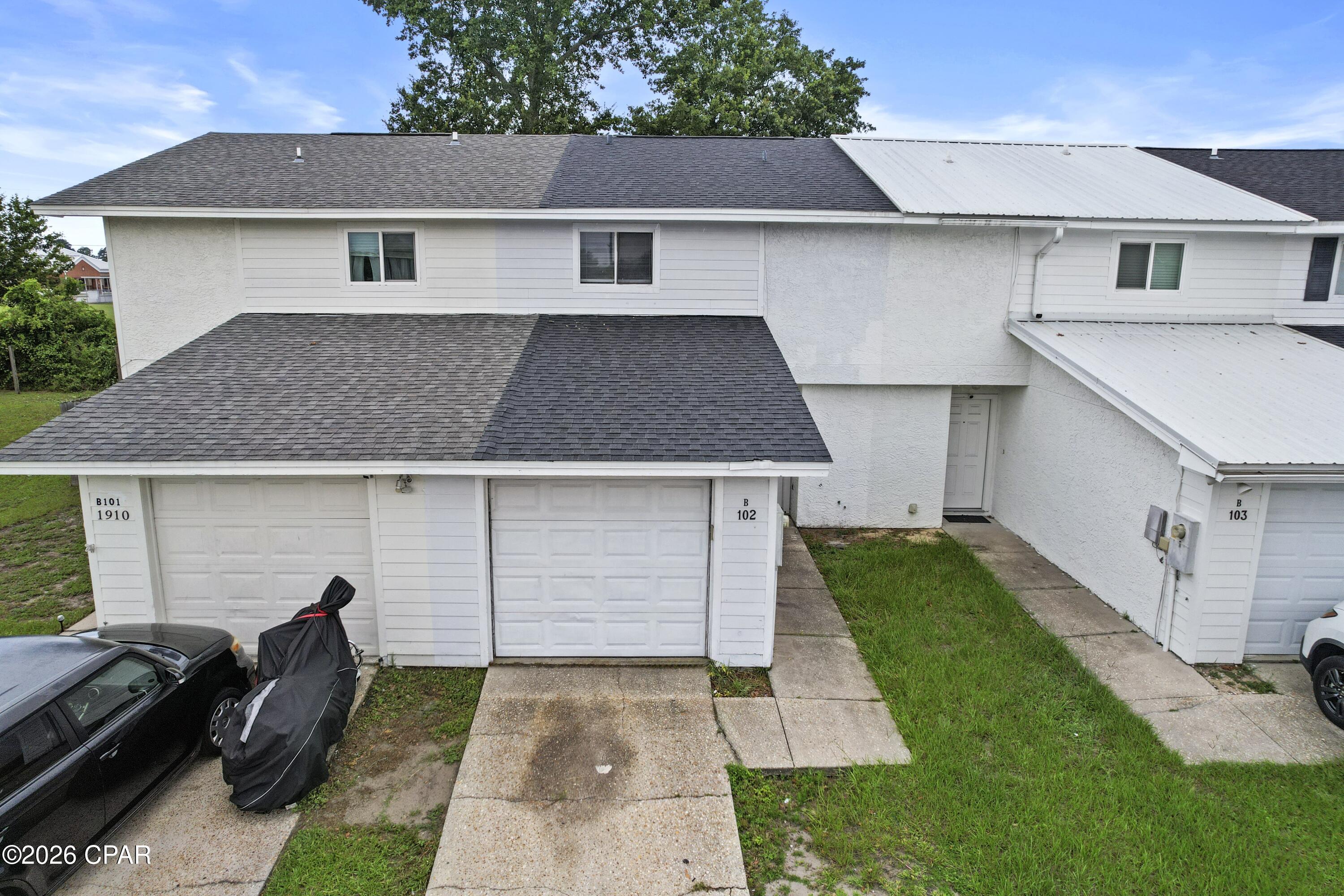 Affordable 3-bedroom, 2.5 bath townhome in the centrally located Gulf Coast Village subdivision of Lynn Haven. Enjoy the convenience of being within walking distance to Mowat Middle School, shopping, restaurants, and everyday amenities, making this location ideal for both homeowners and investors. The main floor features a good size living area with tile flooring, a kitchen with breakfast bar, a convenient half bath, an interior laundry room, and rear access to the back patio and small yard. Upstairs, all three bedrooms offer new carpet.  The primary bedroom has space for larger furniture and an adjoining bath with a shower/tub combo. Neutral colors throughout provide a great backdrop for a variety of decorating styles. The 1-car garage adds for additional storage or extra parking. Whether you are looking for an affordable place to call home or an investment opportunity, this townhome is worth a look.  Call today to preview.