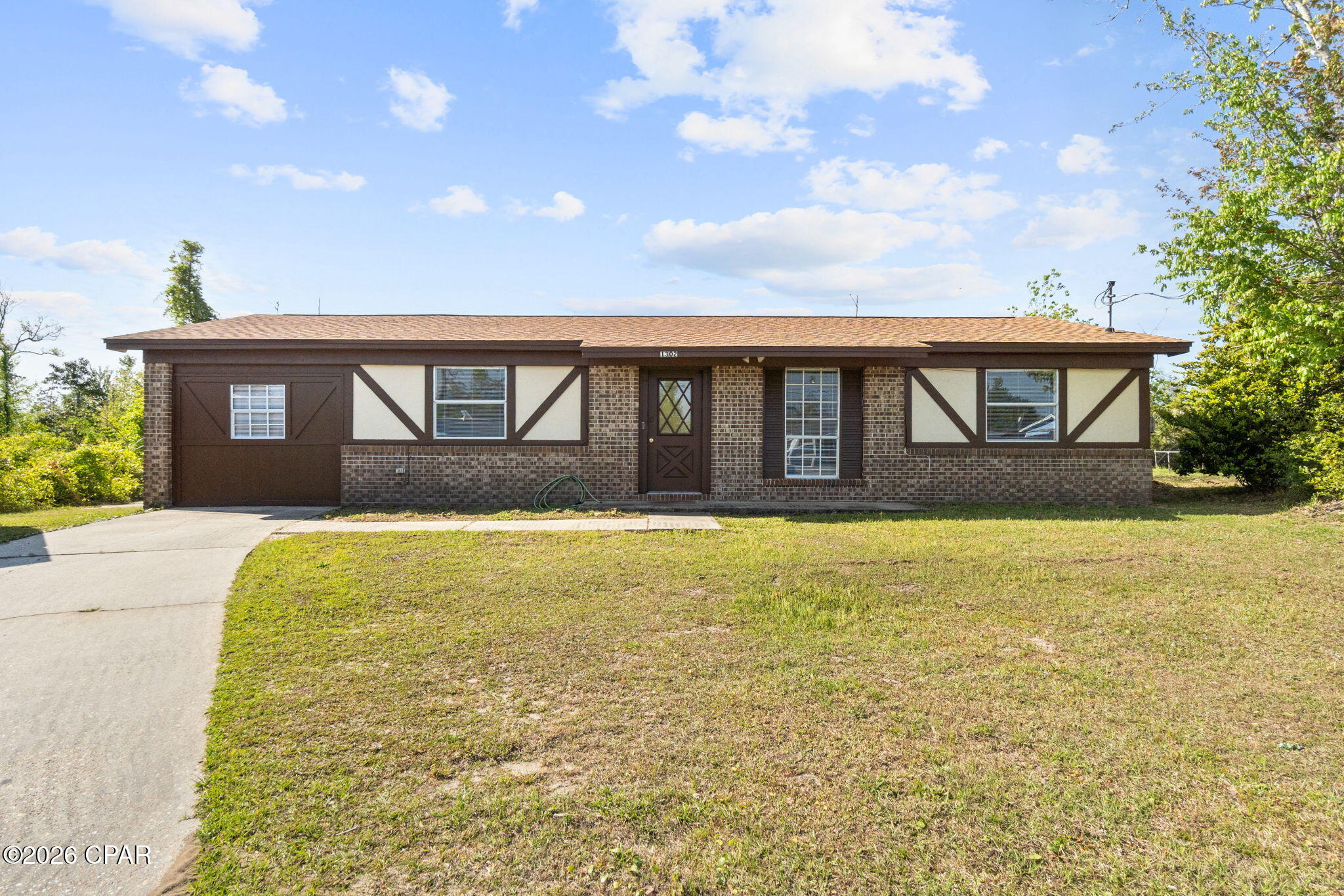 CURRENTLY UNDER CONTRACT, SELLER WILL CONSIDER BACKUP OFFERS

Welcome to 1302 Pinnacle Pines Road -- where value, space, and location come together in a way that's hard to beat. Tucked into a convenient Panama City location, you're just a short drive to shopping, dining, schools, and an easy commute to both Tyndall Air Force Base and the white-sand beaches of Panama City Beach. Whether you're a first-time buyer, investor, or someone looking for a smart move with upside, this one checks the boxes.

This solid, single-story home offers a functional layout with spacious living areas, durable tile flooring, and a kitchen that's ready for everyday living with ample cabinet space and a clean, open feel. Natural light pours in through the sliding glass doors, leading you out to a large backyard with room to spread out, entertain, or create your own outdoor oasis.

One of the standout features? The detached workshop/garage -- a rare find that opens the door for hobbies, storage, a home business, or extra income potential. Add in the extended driveway and you've got plenty of room for vehicles, boats, or trailers.

Inside, you'll also find character touches like wood-accent walls and a cozy, comfortable feel that makes it easy to envision calling this place home. The property offers a great balance of move-in readiness with room to add your own personal touches and value over time.

Opportunities like this -- in a central location, with this much space and flexibility, at a price point that makes sense -- don't last long. If you've been waiting for the right deal, this is it.
