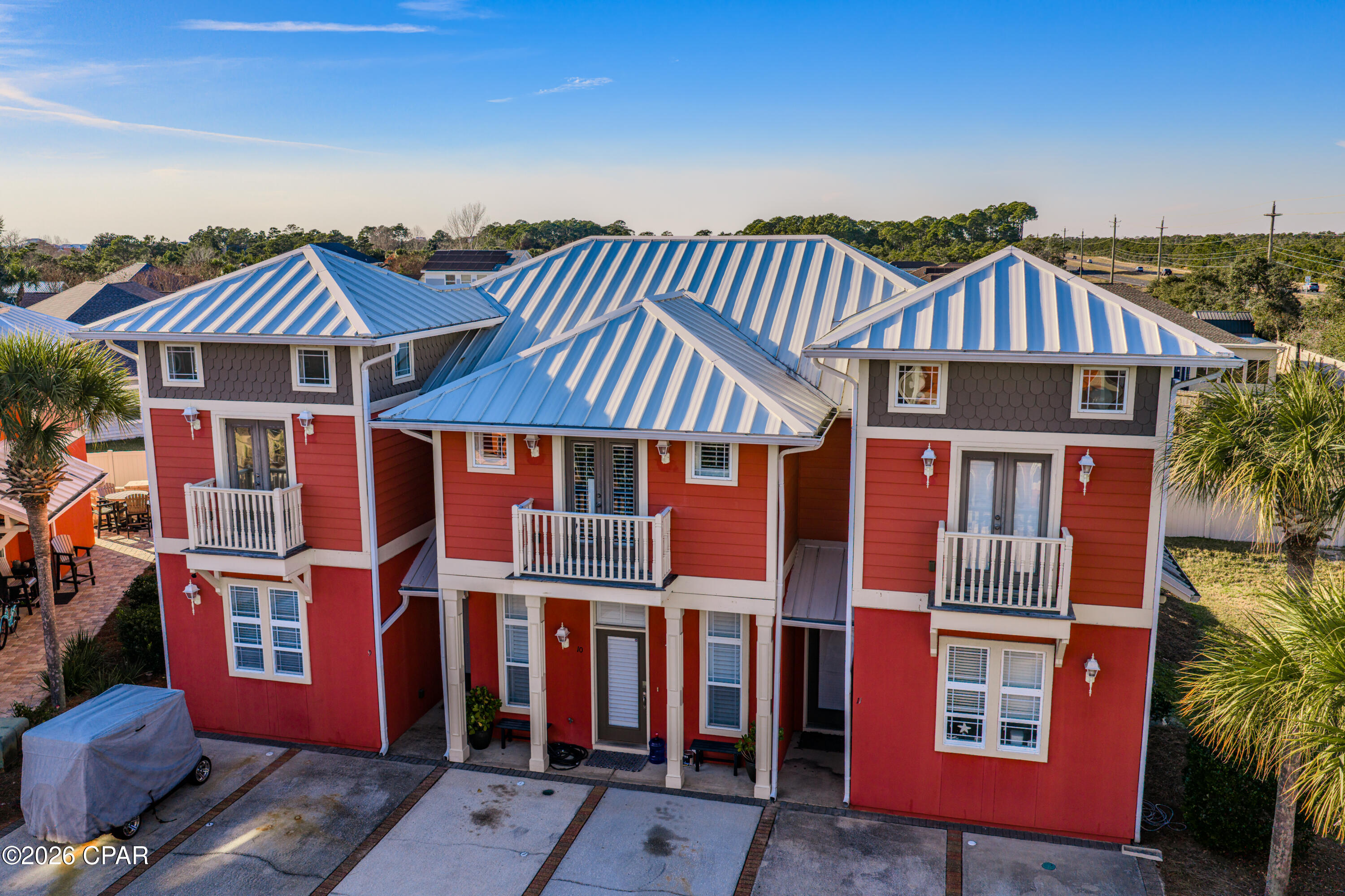 This well-appointed three-bedroom, two-and-a-half-bath residence is located in the highly desirable Coral Bay community, just a short walk, bike ride, or golf cart drive to the white sands of the Gulf of Mexico. The property is conveniently situated near 30A, premier coastal dining, popular local establishments, and the amenities of Pier Park.

The first floor offers a private guest bedroom with an en-suite bath and direct access to the backyard, along with a separate guest powder room. The second level features two additional spacious bedrooms connected by a Jack-and-Jill bath and accented by an elegant Juliet balcony.

Notable interior features include high ceilings, a thoughtfully designed floor plan, and abundant storage throughout. Plantation shutters enhance the living room and primary bedroom windows with vinyl plank flooring.