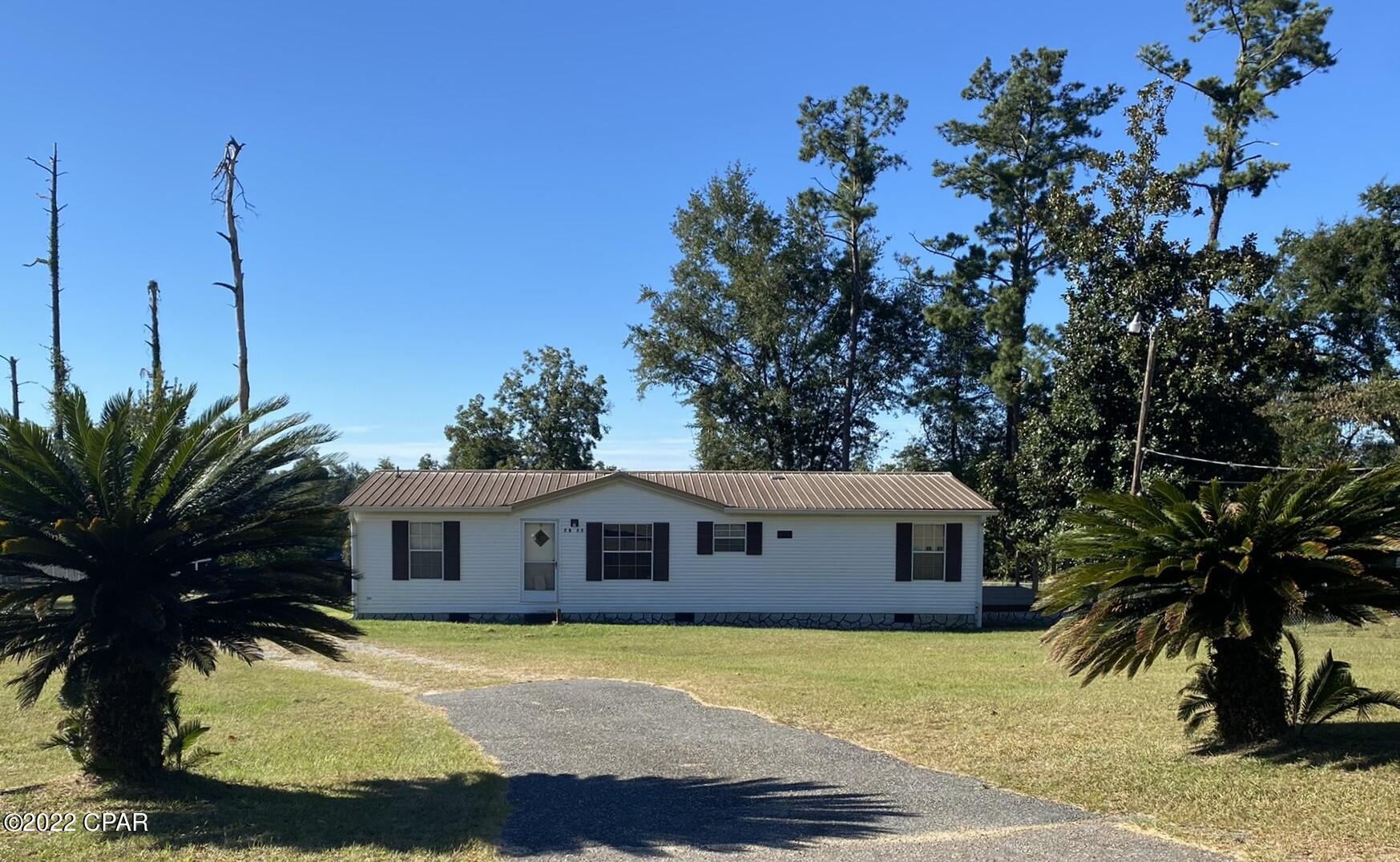 Great starter home or investment property with this 3/2 on a 1/2 an acre +- in a great neighborhood!! Fantastic schools, southern charm community, close to lakes, shopping, playgrounds and schools! Enjoy the covered back deck or the private deck off the master bedroom. There is a huge yard that is partially fenced with two pads for outbuildings. Priced to sell!!