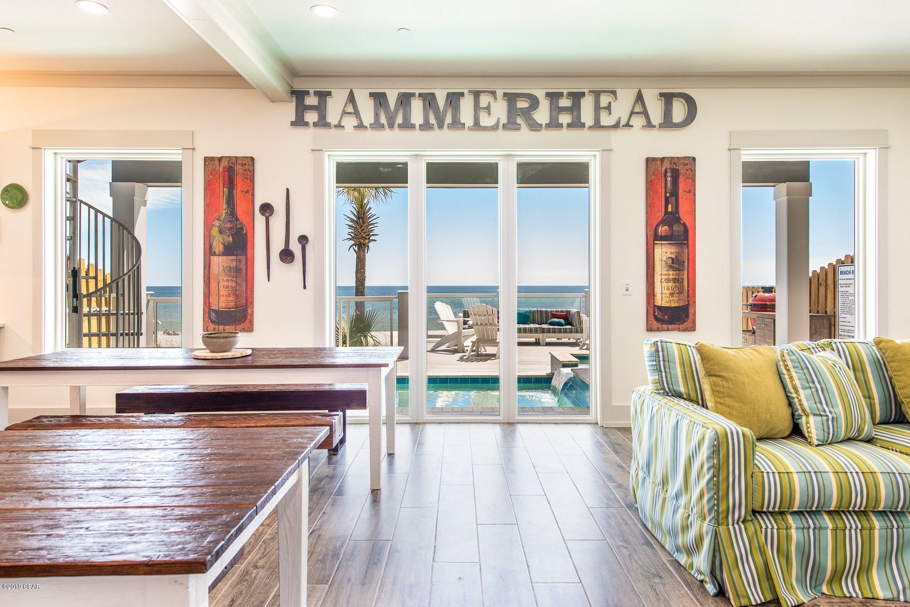 This brand new custom-built four-story beach house is move-in/rental ready and already has summer bookings. This home has a projected income of over $300,000 a year thanks to its prime gulf-front location and 5,198 square feet of luxury vacation lifestyle. Ideal for beach weddings, family reunions, corporate retreats and friends' get-togethers, this beautiful home pampers up to 30 guests with 9 bedrooms including a bunk room, 9.5 bathrooms and plenty of parking. Two fully equipped catering-size kitchens take care of breakfast pancakes to holiday meals or midnight feast. The refectory-style table is a natural gathering place for dining and discussing the day's activities. For dinner, head out along Front Beach Road in either direction and you'll find many options from crab shacks, beach cafÃ©s, ice cream parlors and restaurants all within a mile. When you're not swimming and sunbathing on the white sandy beach, there's a game room and two living areas for relaxing, swapping stories or watching a movie. There's also a loft overlooking the oversize private pool with hot tub. Dive in â€“ the water is perfect. Those in search of quiet moments to relax with a magazine will enjoy plenty of private space on 1200 square feet of decking on four different levels. Soft sea breezes and fantastic emerald gulf views make outdoor living a pleasure on the pool deck and glass-paneled balconies. Panama City Beach offers fishing charters, shopping malls, ZooWorld, go-karts and Wonderworks attractions, making this the ideal base for vacations at any time of year.