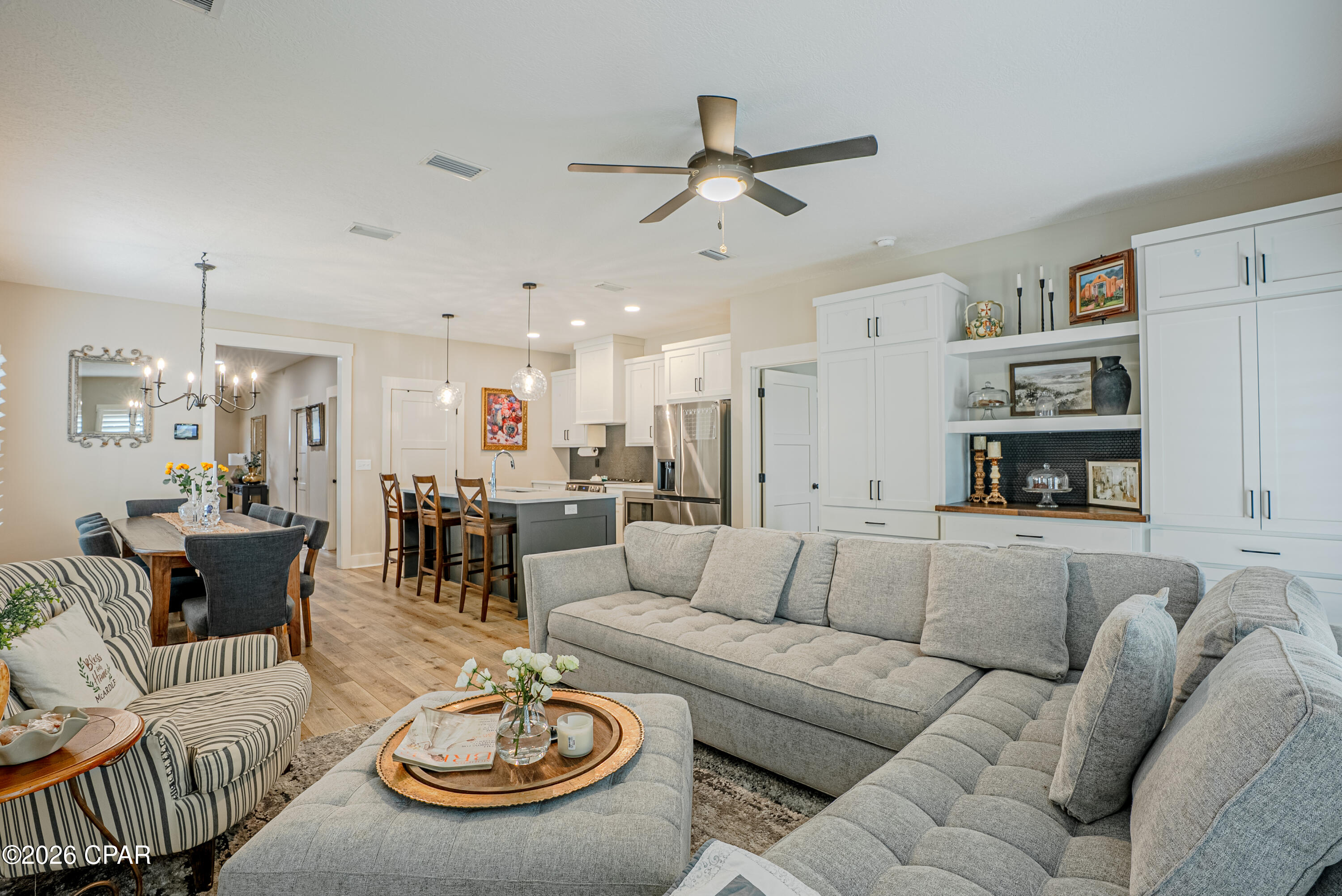 Experience the perfect blend of durability and sophisticated design in this incredibly well-maintained 2023 brick home. Boasting 5 bedrooms, 2.5 bathrooms, and two distinct living areas, this residence offers space and flexibility --all situated in a prime location - just off Hwy 231 between Tyndall Air Force Base and Panama City Beach.

Thoughtful interior design
dual Living Spaces: The main level features a stunning living room with custom-built bookcase that perfectly matches the kitchen cabinetry. Upstairs, a second living area offers a contemporary space perfect for a media room or play area.

Chef's Dream Kitchen: centrally located for effortless flow, the kitchen features custom solid wood cabinets, sleek quartz countertops, and luxury vinyl flooring in high traffic areas Note: The custom matching dining table may be negotiated with offers.

Primary Suite Sanctuary: Retreat to a spa-like bath featuring an elegant stand-alone tub, walk-in shower, and double vanities. The spacious walk-in closet offers the ultimate convenience with direct access to the laundry room.

Premium Upgrades & smart features
custom touches: outfitted throughout with timeless Charleston-style shutters and modern finishes.

Smart Security: Peace of mind comes standard with a full security system and a remote-controlled thermostat.

Exterior Excellence: Low-maintenance living  with a full sprinkler system, underground utilities, and professionally installed exterior holiday lighting.

The Neighborhood
enjoy the safety and charm of a community designed for walking, featuring lighted streets and sidewalks. This move-in-ready gem offers the peace of mind of newer construction without the wait of a new build.