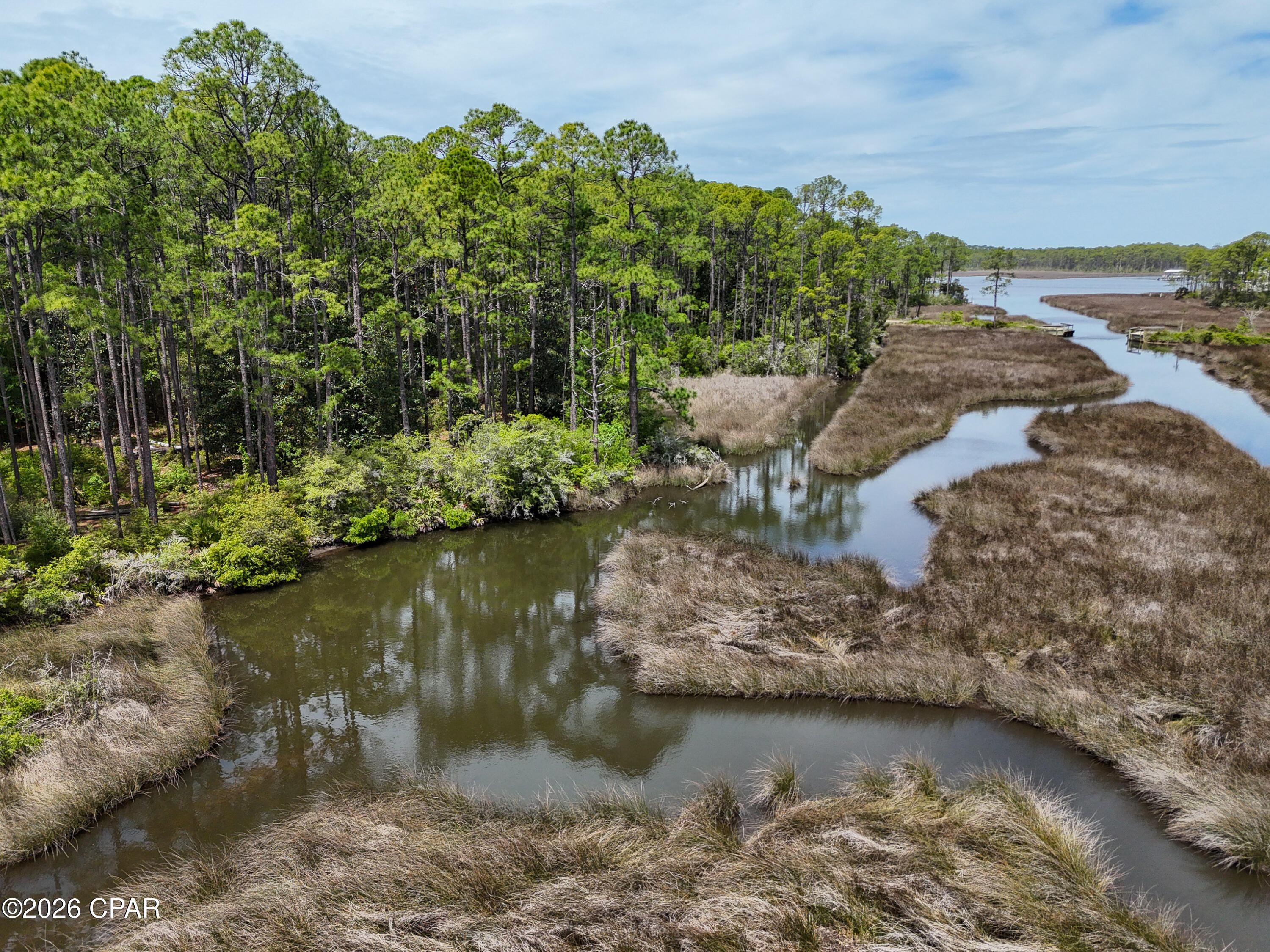 **Waterfront Homesite on Hogtown Bayou - Walton County, Florida**

An exceptional opportunity to acquire a premier waterfront homesite in Walton County. This offering comprises approximately **0.4 acres**, consisting of four contiguous lots (Lots 1-4), and features over **250 feet** of frontage along Hogtown Bayou. The property provides direct water access to Choctawhatchee Bay and the Gulf of Mexico via the Choctawhatchee River, offering outstanding potential for boating, fishing, and a wide range of recreational activities.

Positioned within a protected cove, the site showcases scenic views and a rich natural setting with abundant marine life. The sheltered location also offers ideal conditions for watercraft protection, including the potential for a boathouse within a naturally suited lagoon area. Deep water access, combined with the absence of vertical obstructions, allows for convenient navigation of larger vessels.

The location offers both privacy and accessibility, situated approximately **35 miles** from Eglin Air Force Base and within close proximity to the region's renowned beaches, as well as the amenities, dining, and lifestyle offerings along the scenic 30A corridor.

Recent infrastructure improvements include enhancements to 13th Street by Walton County, along with water and sewer installation by Regional Utilities, providing full utility access via Harley Road, which is county-maintained.

This property presents a rare opportunity to secure a substantial waterfront parcel in a highly desirable area. Prospective buyers are encouraged to contact their real estate professional to arrange a private showing.