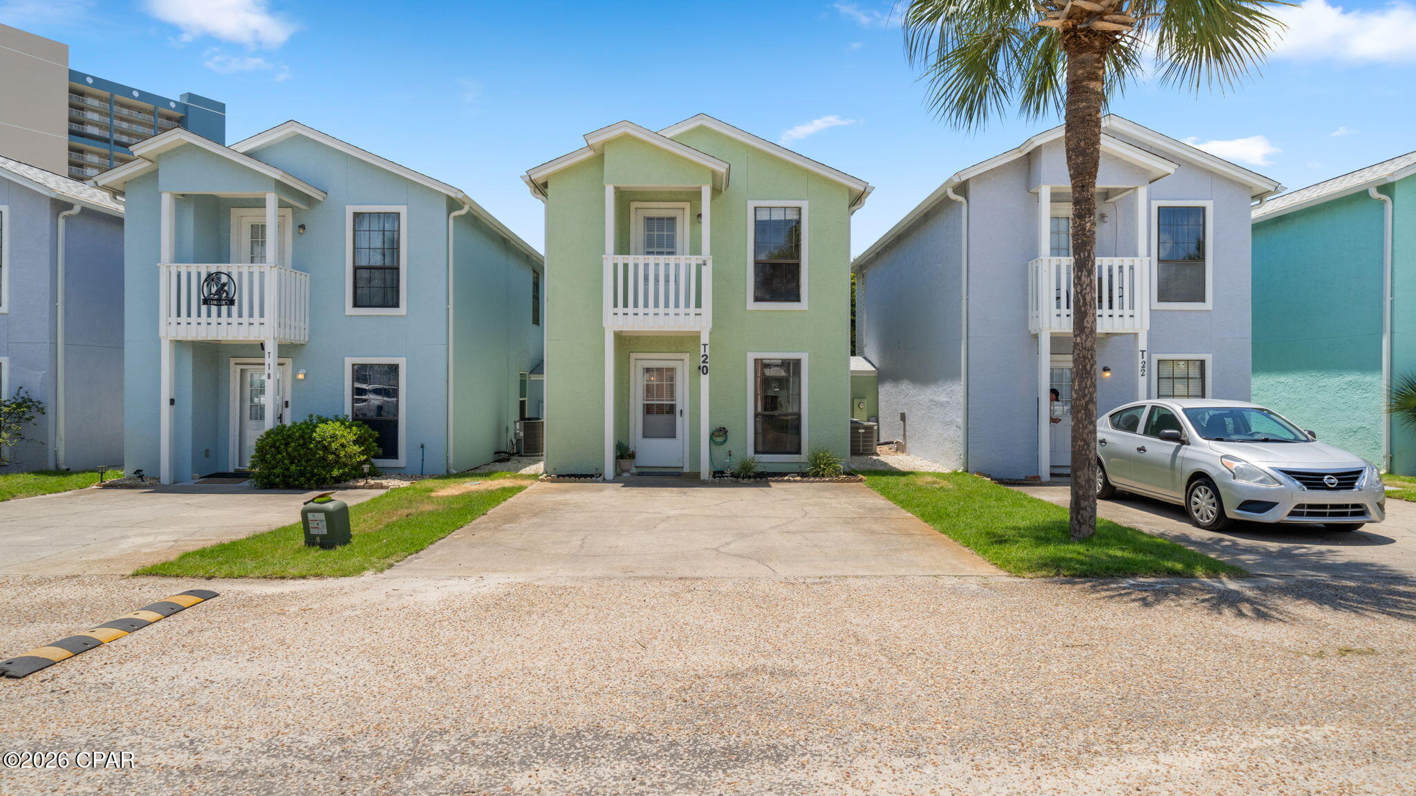 This inviting oasis at 17214 Front Beach Road, Unit T-20, offers the perfect blend of comfort and coastal convenience in the heart of Panama City Beach. Spanning 1,118 square feet with three bedrooms and three bathrooms, the layout feels thoughtfully designed for both everyday living and effortless entertaining.

The rare third bedroom provides flexibility for guests or added income potential. Step out from the primary suite onto your private balcony to savor morning coffee with ocean breezes, while the secondary bedroom balcony offers another peaceful perch to unwind.

Downstairs, the fenced back patio creates a quiet retreat for relaxing or gathering with friends. Two exterior storage closets keep beach gear and essentials neatly organized. The townhome connects only at the storage areas, giving you a greater sense of privacy than typical attached units.

Beyond your door, the community amenities enhance everyday life with two sparkling pools and a clubhouse designed for connection. Best of all, the pristine sandy beach lies just across the street, an easy stroll away whenever the waves call. When you're ready for dining, shopping, or entertainment, Pier Park is only minutes from home.

Ideal for investors seeking strong short-term rental performance or for those dreaming of their own beach escape, this property delivers both lifestyle and opportunity in one distinctive package.

Schedule a private showing today and discover how this special home could become your next chapter on the beautiful shores of Panama City Beach. 
(All measurements are approximate and to be verified by the buyer, if important.)