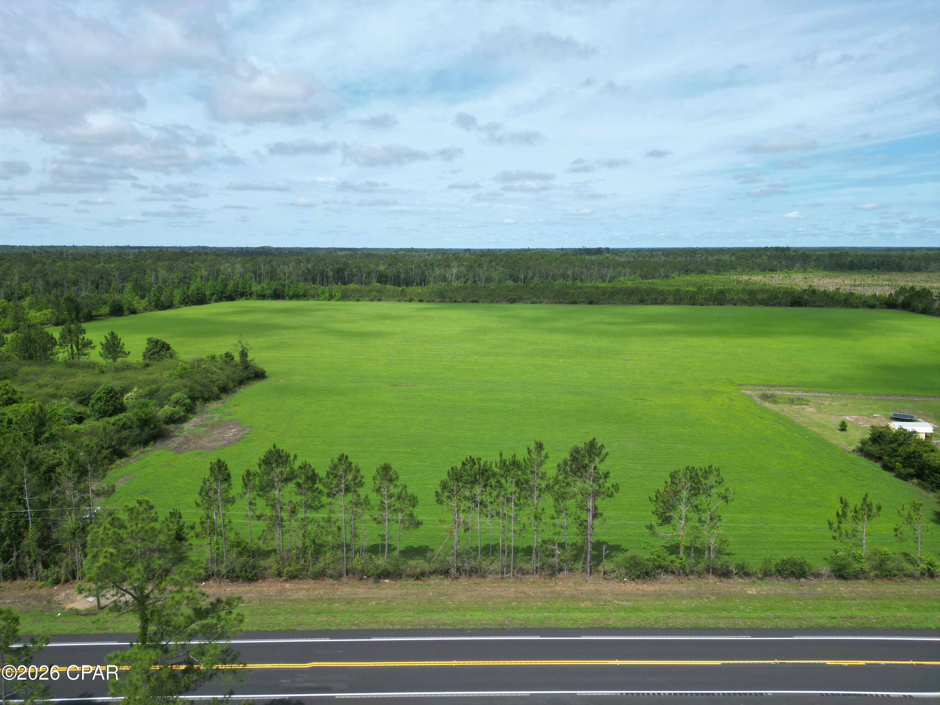 Discover the perfect blend of agricultural productivity, recreational opportunity, and future development potential on this exceptional 35± acre property located just south of Blountstown, Florida. Currently planted in perennial peanuts, this beautiful tract offers both immediate agricultural value and long-term investment appeal.
Whether you're looking to build your dream home, establish a private country estate, create a family retreat, or capitalize on future development opportunities, this property provides the space and flexibility to bring your vision to life.
Nature enthusiasts and outdoor lovers will appreciate the abundance of recreational opportunities in the area. Enjoy hunting on your own property and take advantage of the region's renowned outdoor lifestyle with both freshwater and saltwater fishing just a short drive away. From the rivers and lakes of North Florida to the world-class beaches and fishing grounds of the Gulf Coast, adventure is always within reach.
Ideally situated, the property offers convenient access to the white-sand beaches of Mexico Beach, making it easy to enjoy boating, fishing, dining, and coastal recreation. Travel is equally convenient with both Northwest Florida Beaches International Airport (ECP) and Tallahassee International Airport (TLH) within reasonable driving distance.