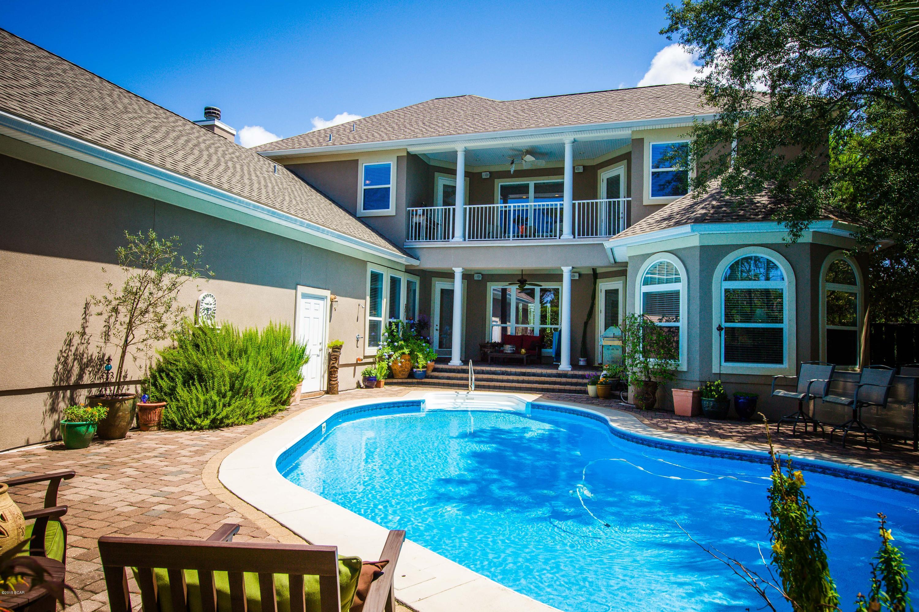 Last chance to buy this Gorgeous CUSTOM BUILT home by Ledman Construction...before it's too late! Home sits on a high bluff with impressive finishes throughout and a large free form pool. Parking is a plus with 3 car garage or parking in front on brick pavers. As you enter this stately home you will be presented into the formal Living area with 21'ceilings open to the 2nd floor! Formal Dining room on one side and official Office on the other & both rooms have large Bay windows overlooking a well manicured lawn. 1st floor continues into a HUGE Chef's kitchen with granite counters, stainless appliances, built in wine frig., chef's gas range with pot filler, pull out tray drawers and more counters and cabinets than most chef's would ever need. Perfect home for entertaining in mind. New Heat Pump Water Heater, Hot Water Circular System with Timer, 3 Separate Heat Pumps with Programmable Thermostats, Wood Burning Fireplace with Gas Starter, Electric Fireplace with Heat Settings, Security System, Vinyl Windows with Low-E Glass, Near Floor Window Tempered Glass, Structured Wiring For Cable-Internet and Phone Throughout, Built-in Speakers with Volume Controls to Stereo, Well Water Softener, Electric Outlets Located in Baseboards, Wall Safe, Huge Attic Storage Area with Interior Access Door, 2 x 6 Construction, Pool Door and Windows Alarm, New Pool Pump and Chlorine Dispenser, New Jet Well Pump, Landscape Lighting with Timers, 40 Year Architectural Roof Shingles, Drip Water System for Potted Plants in the Pool Area...there's more, must see for self!