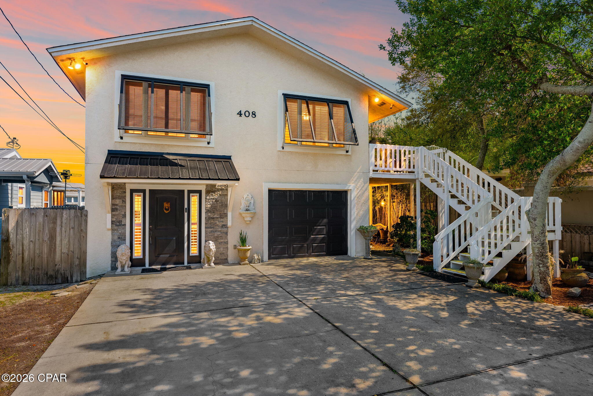 Welcome to 408 Dolphin Street, a rare opportunity to own in the highly sought-after Bid-A-Wee Beach community--one of Panama City Beach's desirable coastal neighborhoods. Located just two blocks from the only gated, private beach accesses in PCB, this home offers an exclusive beach lifestyle that is simply unmatched. Golf cart friendly community and there are no short-term rentals allowed on this street, creating a peaceful, residential setting perfect for a primary home or second home retreat. 
This spacious 4-bedroom, 3 full bath home blends charm, functionality, and thoughtful updates throughout. Inside, you'll find original 3 quarter-inch tongue-and-groove red oak hardwood floors, adding warmth and character to the living spaces. The flexible floor plan features two master suites--one on the main level and one upstairs--ideal for guests or multi-generational living. A downstairs bathroom is also wheelchair accessible, providing added convenience.
Major updates have already been taken care of, including appliances that are just 3 years old with a double oven, a 4-year-old HVAC system, 2 security systems (ring and rep link), new mini split units, new front windows, and plantation shutters throughout the entire home. A one-car garage adds additional storage and functionality.
Step outside to your private backyard oasis, complete with a sweet water well for irrigation (can also be hooked to the home if the water goes out), tranquil koi pond and mature fruit trees including banana, grape, pomegranate, and orange--creating a true Florida retreat. The pool has been recently updated with a new pump and an outdoor shower, perfect for after the beach or pool.
While there is no mandatory HOA, there is a voluntary $100 per year contribution that helps maintain the private gated beach access--one of the most valuable and exclusive features of the Bid-A-Wee Beach community. Located in an established neighborhood, and exclusive access to Bid-A-Wee's private gated beach, this property offers a rare combination of privacy, location, and lifestyle. Call today to schedule a showing.