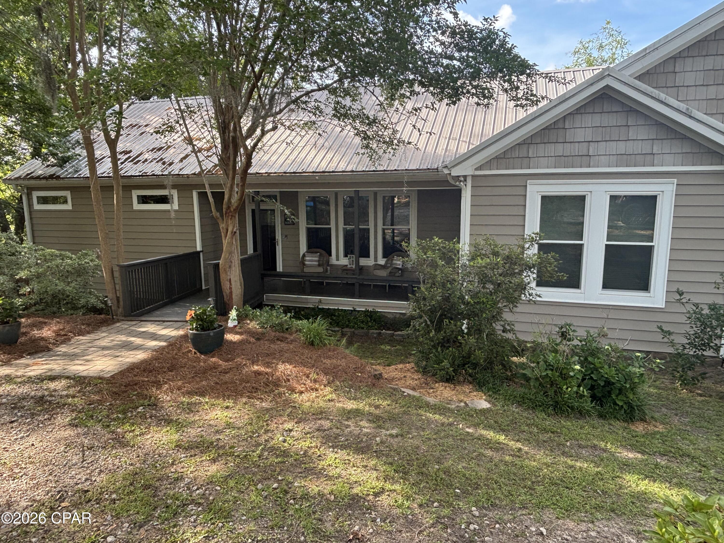 PRICE REDUCED!! This listing includes the waterfront home, a huge barn, and a guest house on 3 acres! The 2944sf barn - (Parcel ID-06-2N-11-0307-00B0-0060) & the 1 bed/ 1 bath cabin (address is 2677 Lakeview Circle- Parcel ID 06-2N-11-0000-0060-0012).

Welcome home to the highly desirable Compass Lake Community! This wonderful waterfront property is a MUST SEE! 

The waterfront home was tastefully renovated in 2019 with many upgrades such as the metal roof, HVAC system, storm windows & LVP flooring throughout. The stainless steel appliances were purchased in Dec of 2025, as well as a new water heater. The picture windows give you ample natural light throughout the home to enjoy gorgeous lake views from the primary suite, living room, den, dining room and the kitchen. You will love the oversized screened in upper deck that is perfect for entertaining! In the backyard you'll enjoy the large covered patio with plenty of space for outdoor living, along with an outdoor shower for your convenience after a day out on the lake.  The 300sf dock house with enclosed porch, 2 docks with a boat shed and a shared dock gives you more than enough room for your boats, jet ski's, and storage for your all of your lake supplies.  

The Barn has a large loft area and a full bathroom. There is room to store your boats, golf cart, jet skis, and even an RV!  Approx. 850sf of the barn is heated and cooled. There is an additional storage shed that is heated and cooled near the big barn.

The cabin was the original home on the water here, and has since been moved up the hill. Built in 1962, it has it's original charm, but includes several modern upgrades.  This adorable home would make a perfect Air B n B rental, or a wonderful guest house for family and friends. It has amazing views of the lake, and woods in the backyard so you are soaking in all of nature with an abundance of wildlife.  The cabin also has an outdoor shower and large screened in porch for taking in the scenery.
The home and cabin both have termite bonds, and there is a water filtration system on the deep water well.

The Compass Lake community has NO HOA but there is a public boat ramp for your use, and a Members Only boat ramp for those that join the boat club.  Homes on Compass Lake rarely are available for sale, as they are passed on through the generations.  This 700 acre spring fed & crystal clear lake is a great place to enjoy boating, skiing, wakeboarding, canoeing, paddleboarding, & fishing.  This quiet and picturesque community on Compass Lake is the perfect place to call home. If you love nature and the outdoors, then this is the home you've been looking for! 

 GO SEE this amazing property today!
 All measurements are approximate, please verify if important.