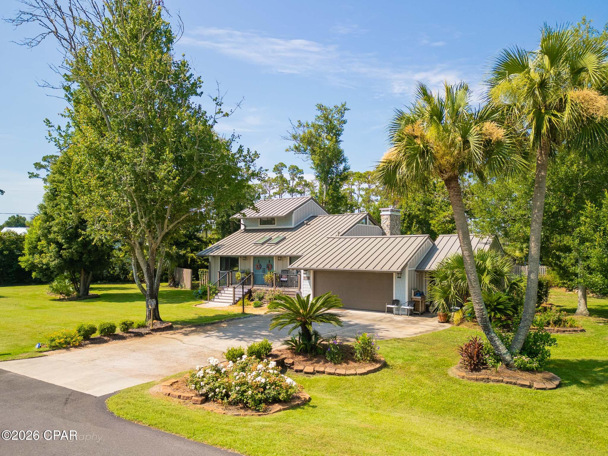 There's something about DuPont Drive. It's one of those quiet, classy streets in Port St. Joe where people tend to stay put once they find a home here -- and 302 DuPont is a great example of why.
The inside has been thoughtfully remodeled and it shows -- clean, updated, and genuinely move-in ready. Outside, mature trees and well-established landscaping give the yard a settled, lived-in beauty you can't fake with new plantings. There's covered and open outdoor space to stretch out on, whether that's morning coffee or an evening with friends.
Three bedrooms, two bathrooms, and a location that's hard to beat: walk to St. Joe Bay, hop over to downtown for dinner or shopping in minutes, and stay close to local schools. This is Port St. Joe living at its most comfortable.