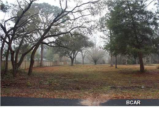 JUST REDUCED! Beautiful cleared building lot in the heart of Lynn Haven. This lot is almost one full acre (.93) and located in the College Point area. If you are wanting a lot to build your new home and not wanting your neighbor's house 10 foot over from yours then here is your chance! The Sellers have prepped and primed this property for your new custom home with a geo technical survey conducted by Southern Earth Sciences in 2012 and a land survey by Buchanan & Harper Engineering. The Sellers have a professional engineer design for the water and sewer connections. The lot is high and dry with 13 to 14 foot elevation. There are numerous live oak trees, water oaks and pecan trees that were recently pruned under the supervision of a consulting arborist. There is a community park