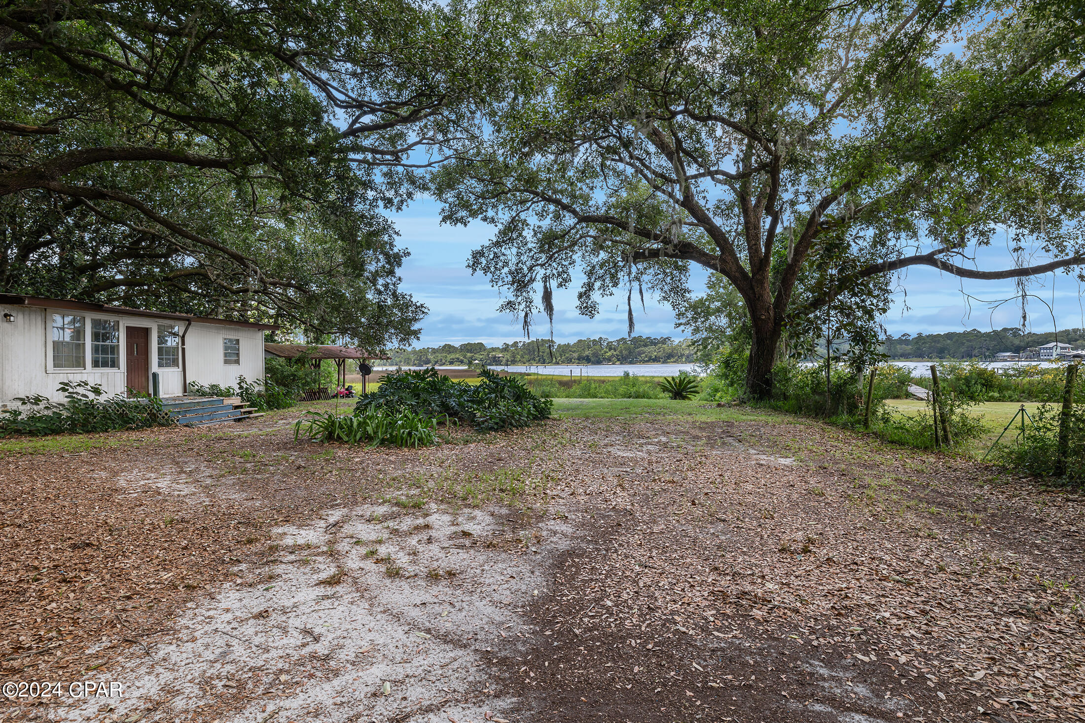 UNDER CONTRACT TAKING BACKUPS

Bayfront Property with Endless Potential!

Welcome to 7913 1st St., Panama City Beach, FL! This unique bayfront property boasts over 90 feet of pristine waterfront, offering breathtaking views and serene coastal living. Nestled on a generous lot, this property features two homes, providing a rare investment opportunity or the perfect setting for an extended family retreat.

Main Home:

3 Bedrooms
1 Bathroom
Built in 1962
Charming vintage details
Spacious living areas with natural light
Potential for customization and modernization

Second Home:

2 Bedrooms
1 Bathrooms
Cozy and quaint
Ideal for guests or rental income
Great bones with room for improvement
Both homes require some TLC, presenting an excellent chance to bring your vision to life and create a personalized paradise. The expansive bayfront offers endless possibilities for outdoor activities, from fishing and boating to simply enjoying the stunning sunsets over the water.

Conveniently located near local amenities, schools, and the vibrant Panama City Beach community, this property is perfect for those seeking a tranquil yet accessible lifestyle. Don't miss out on this exceptional bayfront gem!

Schedule your private showing today and explore the potential of 7913 1st St.!

Back on the Market at no fault of the sellers