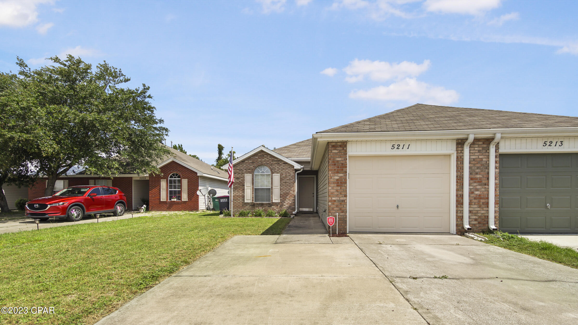 CURRENTLY UNDER CONTRACT, ACCEPTING BACK UP OFFERS. 3 Bedroom/ 2 Bath BRICK single unit townhome located near TYNDALL AFB, shopping, restaurants and more! Featuring a split floor plan, spacious living room with vaulted ceiling overlooking the kitchen/bar; Laundry and garage located just off the the kitchen. Secondary bedrooms & full bath situated off the entry way. Master features a walk-in closet and shower.  The exterior showcases fresh landscaping, an extended driveway, fenced backyard and covered back patio. Roof is 2019! All sizes/info approx; please verify if important.
