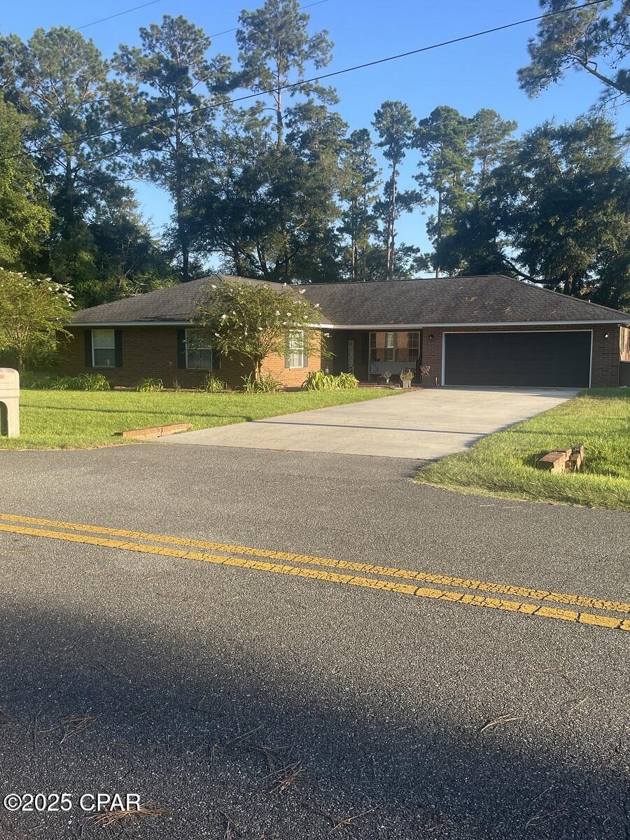 $325,000. PRICE REDUCTION! When you step into the foyer you immediately feel ''at home'' in this 1993 brick home with 2,466 sq ft of heated/cooled living space. There is plenty of room for your family to enjoy! With 3 BR's, 2.5 baths, living room, formal dining room, den, breakfast room, kitchen, pantry (or mud room), and hallway closets, one that measures 6'8'' x 7'2''.... a bonus closet with shelving for organized indoor storage! The painted concrete floors in the den, dining room, breakfast room, and master BR are etched with large squares. Two of the BR's have carpet, the foyer and hallway have lovely parquet, the kitchen and living room have vinyl plank, and the bathrooms have tile floors. Laundry hook-up and recently-replaced water heater are located in the enclosed 2-car garage, which has an automatic door opener. The roof was replaced in 2019. (This home was originally wired with a security system that could be updated and activated, if desired. The in-ground sprinkler system has not been used in years, but it could be revived/reactivated if one chooses to use it.) Kitchen appliances include stove, refrigerator, dishwasher, microwave, and garbage disposal. Located inside the city limits of a small NW Florida town, children could walk 1.5-2 blocks to the local high school, and the K-8 school is only a 3-4 minute ride, as well. This property is situated in a quiet neighborhood and features a fenced back yard, paved streets, city water, city sewer, and garbage collection. What more could you ask for?! Start making memories with your family right away in this comfortable home, listed for just $131.79 per sq. ft.! $325,000.