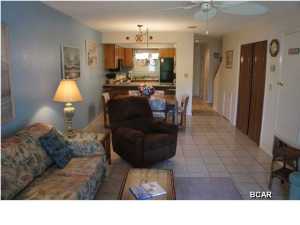 Fully furnished, immaculately maintained, 2 bedroom / 1.5 bath condo in the most private area in Portside. This condo is located in the most desirable building in Portside, the ''J'' building, which backs up to a natural green space owned by the Portside HOA which provides a peaceful and relaxing surrounding away from through traffic. There is a second community pool that is steps away from the J building which provides its owners and guests with the opportunity to utilize a ''less crowded'' community pool. Many upgrades including hardwood flooring, new carpet upstairs, and new kitchen countertops, provide the new owner with an opportunity to buy a ''turn key'' condo. Tile is located in the dining and living room area for easy maintenance. A truly unique offering, everything in