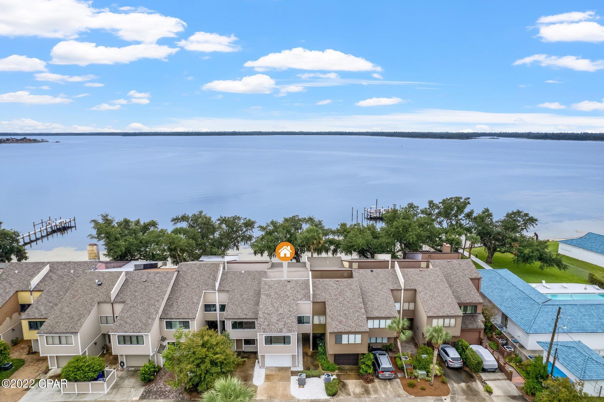 Check out this Amazing 3 Bedroom and 2 Bathroom Townhouse on the Water located in The Cove. This Townhouse has been remodeled with Brick Archway, Open Floor Concept, Vinyl Plank Floors, Tile Shower, and So much more. The Master Bedroom has a Walk in closet, and a balcony that overlooks the Bay. The rear patio leads to a sandy beach where you can swim, Kayak, and Paddle Board. The townhouse is a must see, and won't last long.