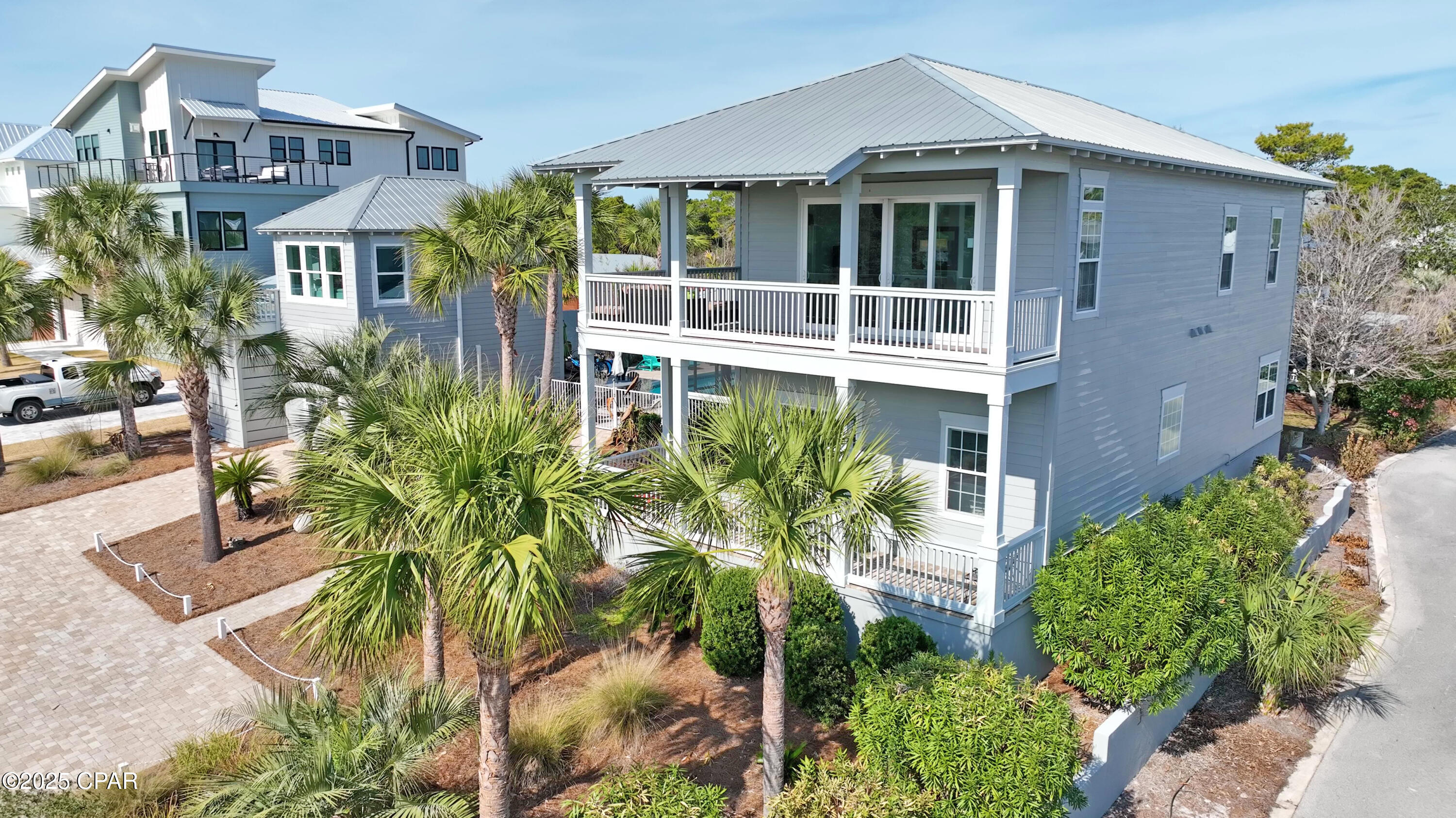 Salty Dunes -POOL!! Luxurious 7-Bedroom Coastal Retreat in Blue Mountain Beach**  
Welcome to Salty Dunes, an extraordinary 7-bedroom, 5.5-bathroom beach home in the heart of Blue Mountain Beach, offering the perfect blend of luxury, comfort, and coastal charm. With enough space to comfortably sleep 19 guests, this stunning property is ideal for large families, group getaways, or a high-income vacation rental investment.  
Prime Location - Just 1/4 mile from the sugar-white sands of the Emerald Coast, you're only a short stroll or golf cart ride from the breathtaking Gulf waters. Spend your days lounging on the beach, biking the scenic 30A trails, or indulging in the area's best shopping, dining, and entertainment.  
A Home Designed for Relaxation & Entertainment  
From the moment you arrive, the salty sea breeze and lush tropical landscaping welcome you to your dream getaway. This two-story beach retreat features double-decker wrap-around porches, providing the perfect spot to sip morning coffee or unwind in the evening.  
Step inside to find bright, beachy décor and an open-concept layout, seamlessly connecting the living room, dining area, and fully equipped kitchen—ideal for entertaining. The first-floor primary suite offers a king bed, spa-like en suite bathroom with a soaking tub and walk-in shower, plus private access to the backyard oasis.  
Upstairs, discover four more beautifully appointed bedrooms, including a second spacious suite with a king bed, private kitchenette, and access to the second-floor porch. A bunk room for the kids, additional queen bedrooms, and multiple updated bathrooms ensure plenty of space and comfort for every guest.  
Bonus Spaces - Pool House & Carriage House  
Need extra room? Salty Dunes offers two detached living spaces for added privacy.  
- The Pool House includes a TV lounge, arcade machine, and lofted queen bed, making it a perfect hangout for teens or young adults.  
- The Carriage House, located above the garage, features a cozy living area, kitchenette, queen bedroom, and private bath—a fantastic retreat for guests who prefer their own space.  
Backyard Paradise - Private Pool, Screened Porch & More. Step outside to your very own private fenced-in oasis, complete with a sparkling pool (heating optional), screened porch, sundeck, and gas grill for unforgettable gatherings. Rinse off in the outdoor shower after a day at the beach, or hop on one of the complimentary bikes or golf cart to explore the scenic 30A area. The Ultimate 30A Lifestyle Awaits  
Beyond the home's incredible features, Blue Mountain Beach offers a laid-back coastal vibe, award-winning dining, charming boutiques, and endless outdoor activities. Whether you're here to relax by the waves, bike the trails, or experience 30A's vibrant scene, Salty Dunes delivers an unforgettable beachside experience.  
Now Available - Don't Miss Out on This Stunning Beach Home  
Whether you're looking for a dream vacation home, a prime rental investment, or your own slice of paradise, Salty Dunes is the perfect opportunity. Schedule your showing today.