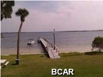 Enjoy beautiful bayviews in this best priced retreat in town and still be close to downtown and Sacred Heart Bay Hospital! Upon entry, one is drawn to the balcony to view beautiful sunsets on the bay. Enjoy your new kitchen with granite countertops and like new appliances. Enjoy a sparkling pool, Bay, beach and dock right out of your front door! There have been abundant improvements made to Bay Club including plumbing fixtures,garbage disposal, A/C, plumbing, ceiling fans and new tile. The property is quiet, secure and maintained immaculately. You can launch your boat or tie up to the dock. Come view this as soon as possible. All measurements subject to verification.
