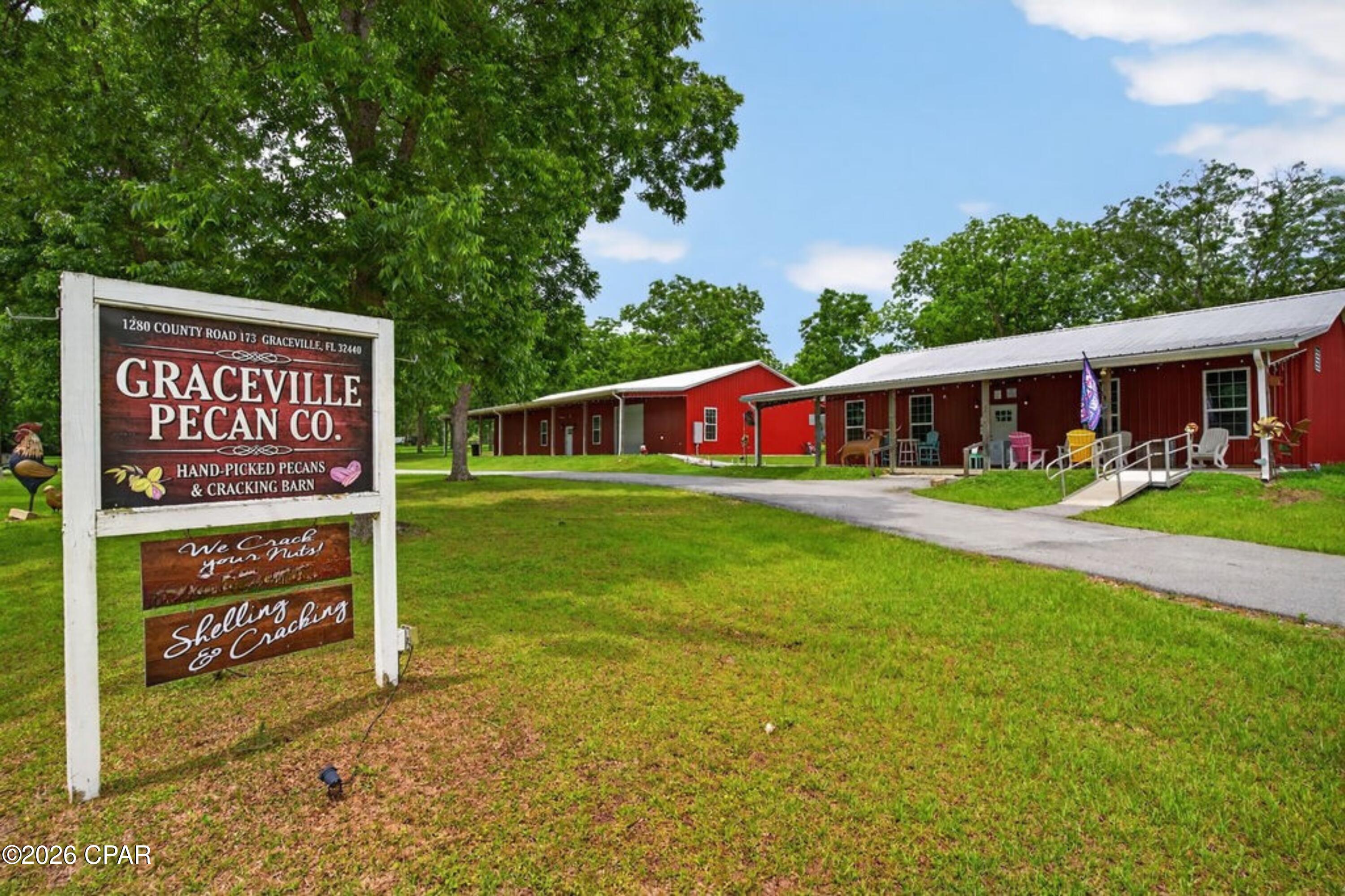 This unique and fully operational pecan business offers an incredible opportunity to own a turnkey agricultural and commercial property situated on over 20 acres. The property is equipped to handle every stage of the pecan process--from washing, cracking, and shelling to processing the pecan shells for grilling use--making it a rare and versatile investment. Approximately 160 mature pecan trees are spread throughout the property, providing both beauty and production potential. Included is a charming 3-bedroom, 1-bathroom home, along with one well, three septic systems, and a full RV hookup for added convenience and flexibility.

The impressive improvements include a 32x50 enclosed barn featuring three bay doors and a half bath, a massive 36x80 enclosed barn equipped with 3-phase electric and 220 amp service, and a 40x80 pole barn complete with a 20x80 lean-to and additional equipment storage space. A portion of the land is located across the street and would make an excellent homesite, offering additional possibilities for expansion or future development. Whether you're looking to continue the existing pecan operation, expand into additional agricultural ventures, or enjoy country living with income-producing potential, this one-of-a-kind property is packed with opportunity.