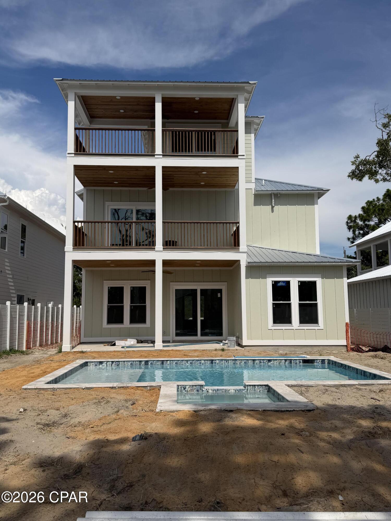 COMING SOON - NO SHOWINGS Beautiful Custom new construction home. Less than 4 blocks from the beach. Five bedrooms, four full bathrooms. Top floor optional for bunk room, bonus room, overs size bedroom. Custom hardwood floors, and fabulous tile showers floor to ceiling.
Open floor plan living area on first floor overlooking custom, pool and spa with beautiful covered porch area to enjoy the outdoor areas.
Front and back have been beautifully transformed with pavers.
Fully equipped kitchen with upscale appliances, and accentuated with elegant light fixtures throughout.
Each floor has a private Trex floor balcony overlooking the gorgeous pool and spa. Pool also has a sunshelf in the shallow end with Privacy fence.
New freshly landscaped with sprinkler system.  Short term and Long term rentals are allowed.
Gulf Shore Manor, does have a ''Granted'' Beach Access total of 5 for property owners of GSM.