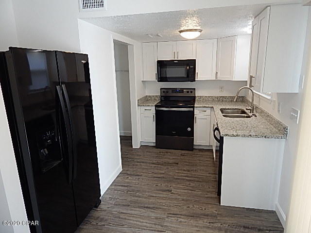 COMPLETELY REMODELED, CENTRALLY LOCATED Very short commute to Navy Base & Tyndall AFB, New Windows, New interior/Exterior Doors and Windows, New Paint, New lighting Fixtures, New beautiful vinyl plank flooring throughout! New Cabinets, New Granite Counters, ALL New appliances. Black appliances: Dbl Door Refrigerator w/Ice and water in the door, glass top - self cleaning stove/oven, new dishwasher and finally a New Hood Microwave. Washer and Dryer Hook Ups. Awesome 1'' steps that have been stained a light grey. NO CARPET ANYWHERE. Small inside cats may be considered with Non Refundable Pet Fee