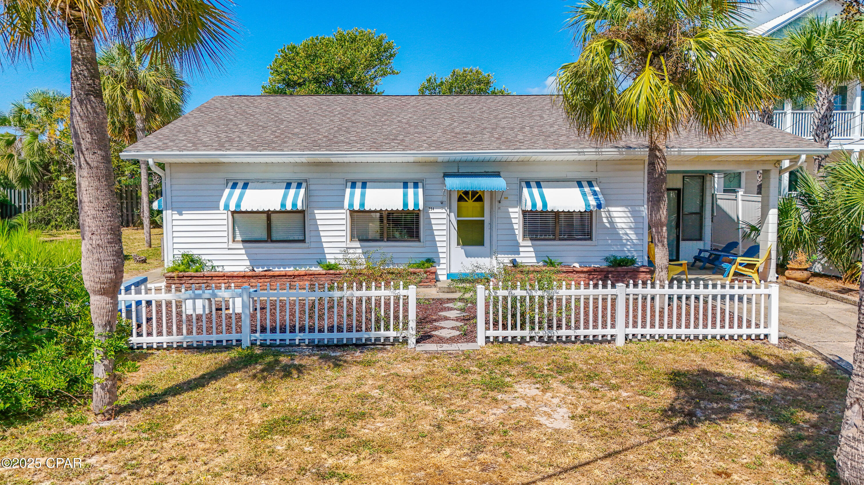 Introducing 234 Sands Street - a multi-family property on the desirable west end of Front Beach Road, just steps from public beach access. This charming beach cottage includes an attached mother in-law apartment and a separate detached cottage. Zoned R-3 and situated on an oversized 0.27-acre lot, it allows for duplex or triplex use. The main home features tongue & groove ceilings, wood floors, two bedrooms, a bunk area, and a spacious Florida room. Both additional units have private entrances, full kitchens, and bedrooms, perfect for short term rentals and extended family stays. With a little TLC, this unique property offers excellent potential for three short-term rentals—an outstanding investment opportunity minutes from Pier Park and 30A!