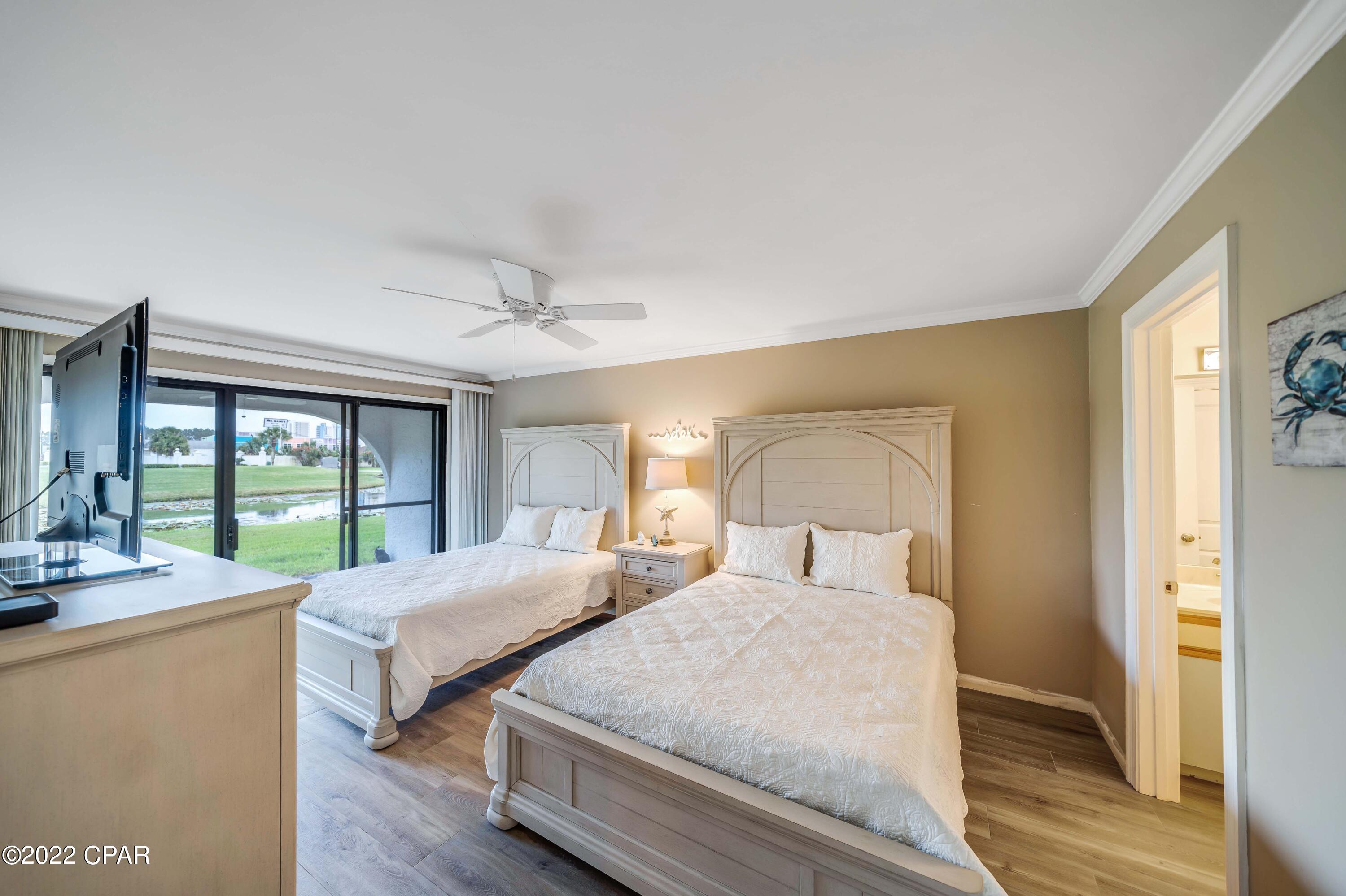 CURRENTLY UNDER CONTRACT - SELLER TAKING BACKUP OFFERS!!! Location is everything and this unit is in a perfect one! GV303 is in the 3rd building from the 24 hour security gate, a full size gunite pool is just steps from the front door, the Conference Center and The Club are right across the street, the walkover to the beach is a very short walkable distance away or you can jump on the Tram that will drive you over to beachside and the huge Lagoon Pool, Oceans Restaurant and so much more. At The Club enjoy golf on the 9 hole par 3 golf course, tennis on the newly installed courts, pickleball, basketball and shuffleboard. The newly renovated Conference Center is the most popular venue on the beach and hosts many events throughout the year and is available for private bookings. Location...this unit is located on the ground floor and parking is right outside the front door. This building also has PLENTY of extra parking just steps away. This pond front unit overlooks a fairway, has a large backyard for outdoor activities and has been newly updated to include new luxury tile plank flooring throughout, new paint, all new furniture and mattresses, new decor, new microwave and kitchen accessories. The patio has sun until around noon and then its shaded the rest of the day. The moon rises directly behind this unit and its so nice to sit outside and enjoy its beauty. Verify measurements if important.