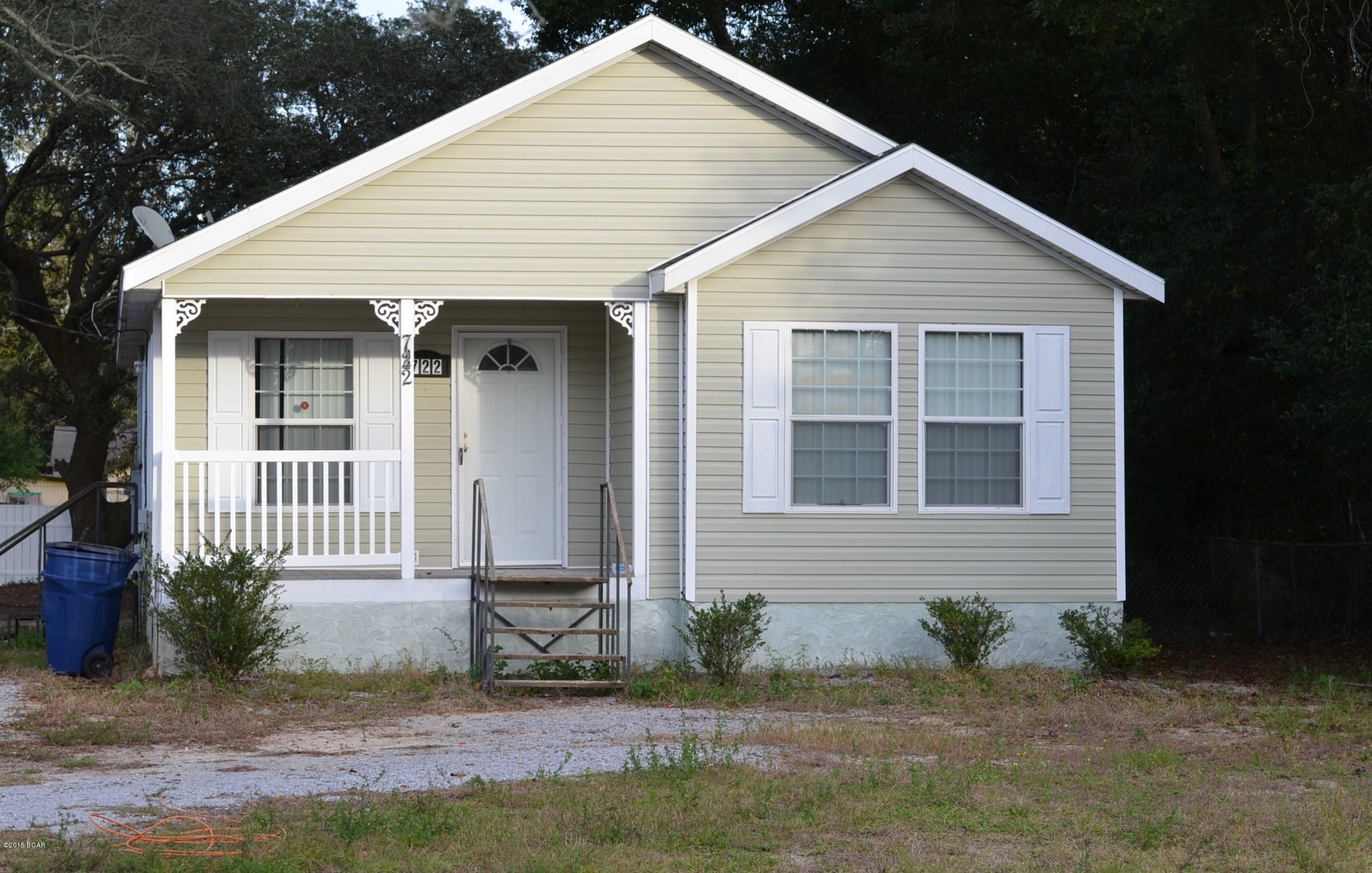 Millville ... adorable vinyl sided cottage ... 4 BRs with 2 full baths on approximately 1,255 SF situated on .494 acres (large lot).  Front and back porch.  Large kitchen with eat in dining area.  Floors are new carpet and vinyl.  Beautiful lot with loads of trees to include grapefruit trees. Convenient to ''downtown Panama City'', hospital, churches, shopping and more. Within 10 minutes to TAFB.  All measurements should be verified for accuracy.