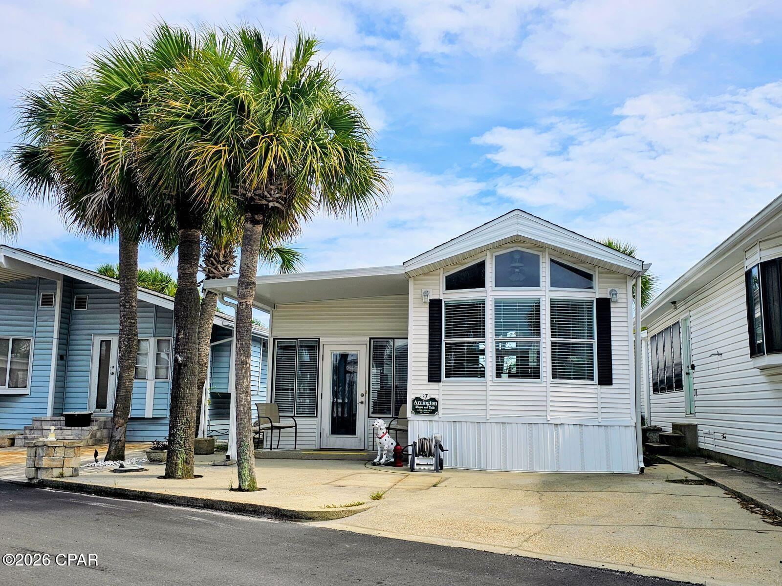 Welcome to 27 Gulf Drive located in the ever popular Venture Out neighborhood. This 2 bedroom 1 bath home comes fullly furnished and ready for your second home, vacation home, or even your primary residence.  The interior of the home is very beach oriented and very inviting to your new guests!  The kitchen has solid wood cabinets and a nice appliance package. Tile and hard  surface floors are throughout for easy maintenance and cleaning.   Aside from one of the best locations in Panama City Beach, the benefits of Venture out are numerous with a dedicated beach and clubhouse on the Gulf, boat launch, pickle ball and tennis, mini golf and a golf cart friendly neighborhood.   Now is the time, the market is heating up!