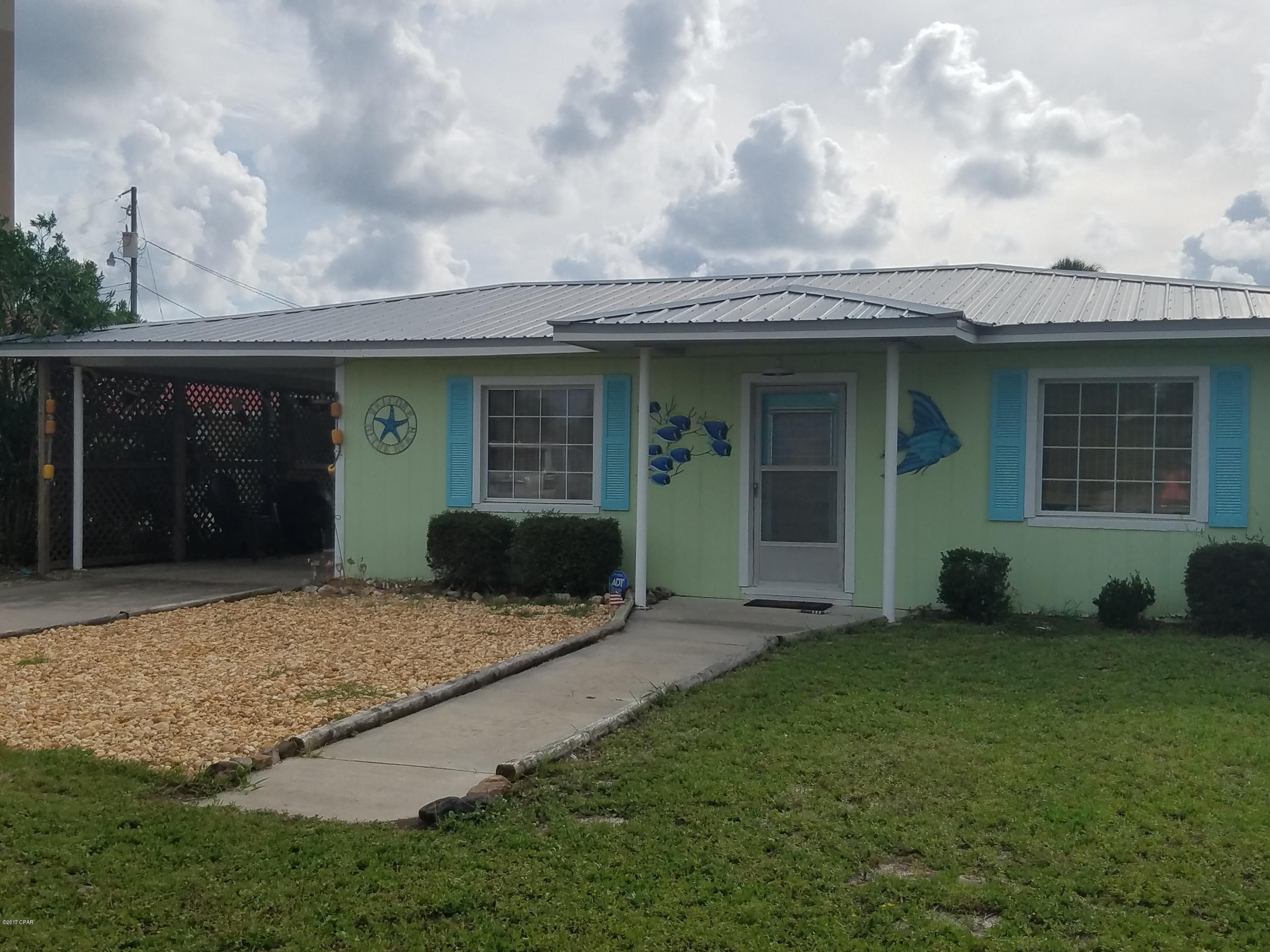 Buoy Bungalow is a fully furnished 2 Bedroom, 1 bath home within a hop, skip and jump away from the beach, Pier Park and Frank Brown Recreational Facility. The convenience is just the beginning with its comfortable living space, plenty of seating and fully equipped kitchen with grill included! The living space and kitchen is all open making it great for entertaining. The master bedroom has a queen size bed and flat screen TV. The second bedroom offers two Full size beds and flat screen TV with DVD player. Additional sleeping includes a Queen sleeper sofa in the living room. Great covered, outdoor patio with Adirondack chair seating and private, outdoor shower to rinse off from the beach or ball field! Property cannot be unfurnished. Lease term 6+ months. Washer/Dryer included. Rent includes water and lawn service. No pets.