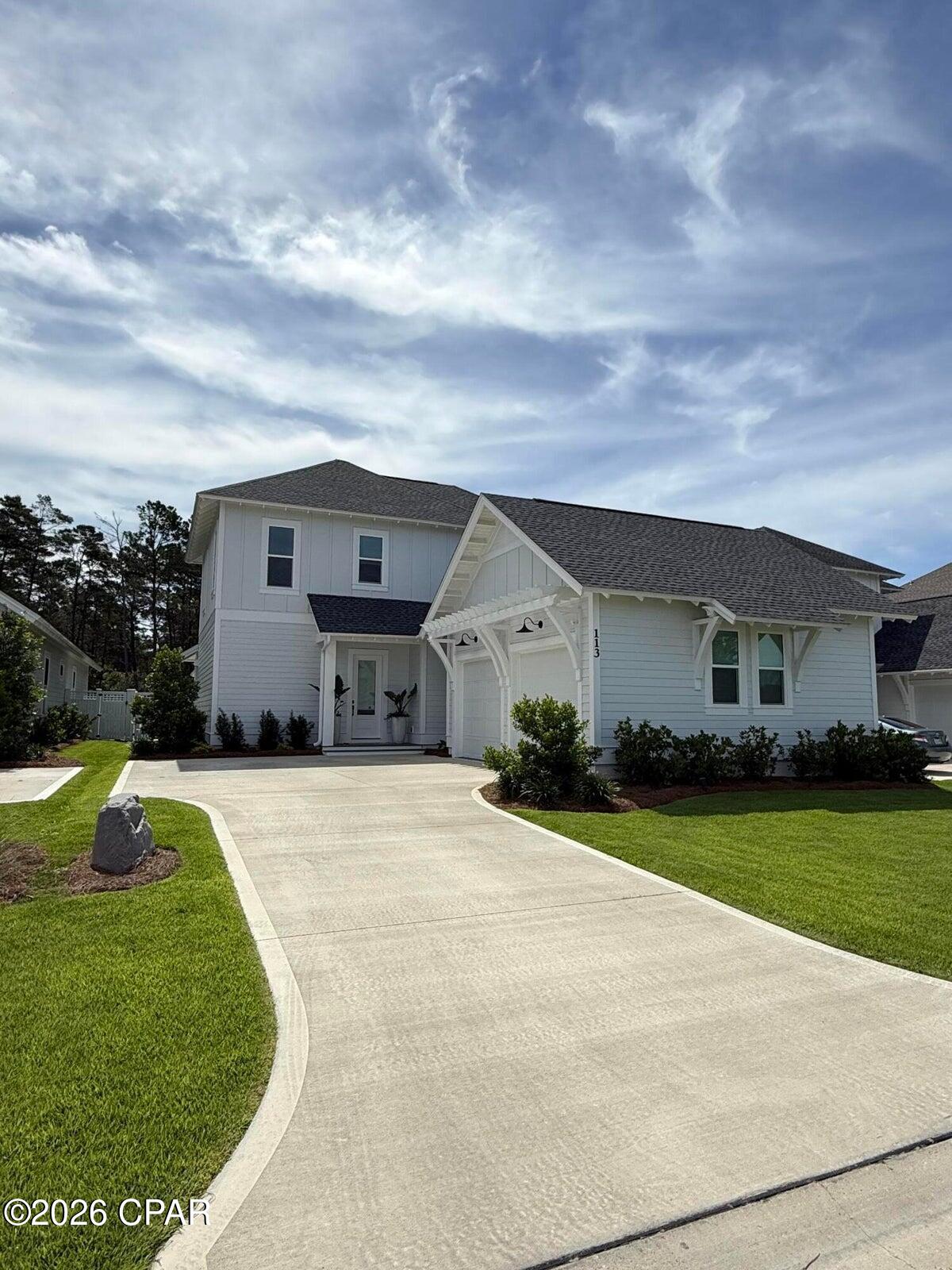 *COMING SOON-NO SHOWINGS* Professional photos forthcoming. Located in the sought-after Powell Landing East phase of Watersound Origins, 113 Pollard Cove East is a beautifully appointed Boswell Builders residence that is just 1 year old and backs to a private wooded preserve. Offering 4 bedrooms, 4.5 baths, & thoughtfully curated upgrades throughout, this home combines luxury finishes, exceptional storage, & outstanding indoor-outdoor living. At the heart of the home is a chef's kitchen designed for both everyday living and entertaining. Premium Thermador appliances include a 36-inch gas range, range hood, microwave drawer, & built-in refrigerator. The stunning WATERFALL island serves as a focal point, while ceiling-height cabinetry with glass-front upper cabinets, 2 walk-up pantries, & an oversized walk-in pantry customized by The Neat Method provide abundant storage. The kitchen flows seamlessly into the spacious dining area & inviting living room featuring a fireplace and shiplap accents. One of the home's standout features is the oversized screened porch overlooking the preserve. Designed for year-round enjoyment, the newly completed outdoor kitchen showcases custom beveled cabinetry by Grimes, a custom tile backsplash, Crown Verity 48-inch gas grill, Thor beverage drawers, BBQ Guys ice maker, & ample entertaining space. Beyond the porch, the professionally landscaped L-shaped backyard by Salty Air includes orange and lime trees, room for a FUTURE POOL, and peaceful preserve views.

The first-floor primary suite offers a private retreat with a unique BONUS NOOK ideal for a nursery, home office, fitness area, or sitting room. The luxurious primary bath features dual vanities, a freestanding soaking tub, a walk-in shower with shampoo niche, and a spacious double-hung walk-in closet.
Upstairs, a cozy loft provides additional living space, while all three guest bedrooms feature en-suite baths and walk-in closets. One bedroom also includes its own linen closet for added convenience.
Practicality meets design with a generously sized MUDROOM offering future customization opportunities, a large laundry room complete with cabinetry and sink, and extensive storage throughout, including a hidden under-stair storage closet accessible from the foyer.
Additional upgrades include custom wallpaper in the powder bath and mudroom, upgraded 2 panel solid core doors, a tankless water heater, custom garage cabinetry and wall fusion storage system by The Neat Method, gutters, and roof moisture vents.
With premium finishes, exceptional craftsmanship, preserve views, and countless thoughtful upgrades, 113 Pollard Cove East presents a rare opportunity to own a nearly new luxury home in Watersound Origins.