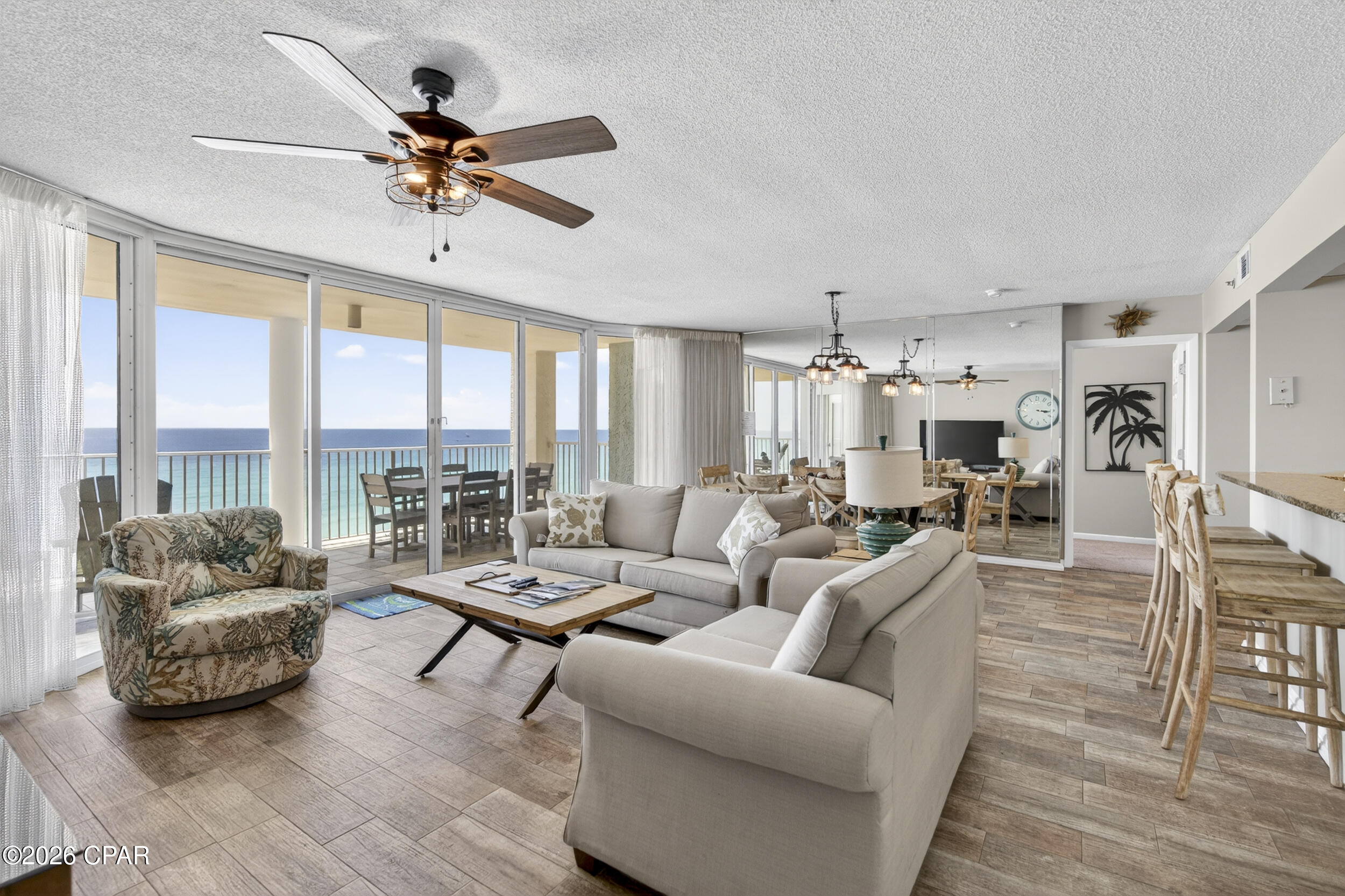 **PRIME LOCATION IN TOWER III** Located at Long Beach Resort Tower 3, this 3BR/3BA gulf-front condo sits directly on the beach in one of the most established resort communities in Panama City Beach. The building is almost finished with a full resort refresh, including extensive exterior restoration, waterproofing, balcony upgrades, and pool enhancements - elevating both appearance and long-term value across the community.

This is a true beachfront floor plan designed around the views. All three bedrooms are positioned on the gulf side, each with balcony access and floor-to-ceiling glass that fills the space with natural light and keeps the water as the focal point throughout the residence. As an end unit, it benefits from added privacy, expanded light, and enhanced views.

The open-concept living and dining area is exceptionally spacious for a condo, creating a comfortable central gathering space that flows directly to the gulf-front balcony. The kitchen features stainless steel appliances, ample cabinetry, and a long breakfast bar that extends the living space for casual dining and entertaining.

Tile flooring runs throughout the main living areas, with carpet in the bedrooms for comfort. Sleeping arrangements are ideal for larger groups, offering two king bedrooms, a third bedroom with two queen beds, and a queen sleeper sofa in the living area - comfortably accommodating up to 10 guests. A separate laundry room with additional storage adds practical convenience.

Ownership at Long Beach Resort includes access to a 7,500 sq ft lagoon-style pool, two heated Polynesian-style pools, three hot tubs, beachfront tiki bar, fitness center, BBQ grilling areas, secure private beach access, 24/7 gated security, and lush tropical landscaping throughout the grounds.

Set directly on the gulf within walking distance to Panama City Beach's most popular dining, shopping, and attractions, this residence brings together expansive beach views, resort-style amenities, and an unbeatable beachfront location.

Offered for those looking for a fully furnished gulf-front opportunity - schedule your private showing!