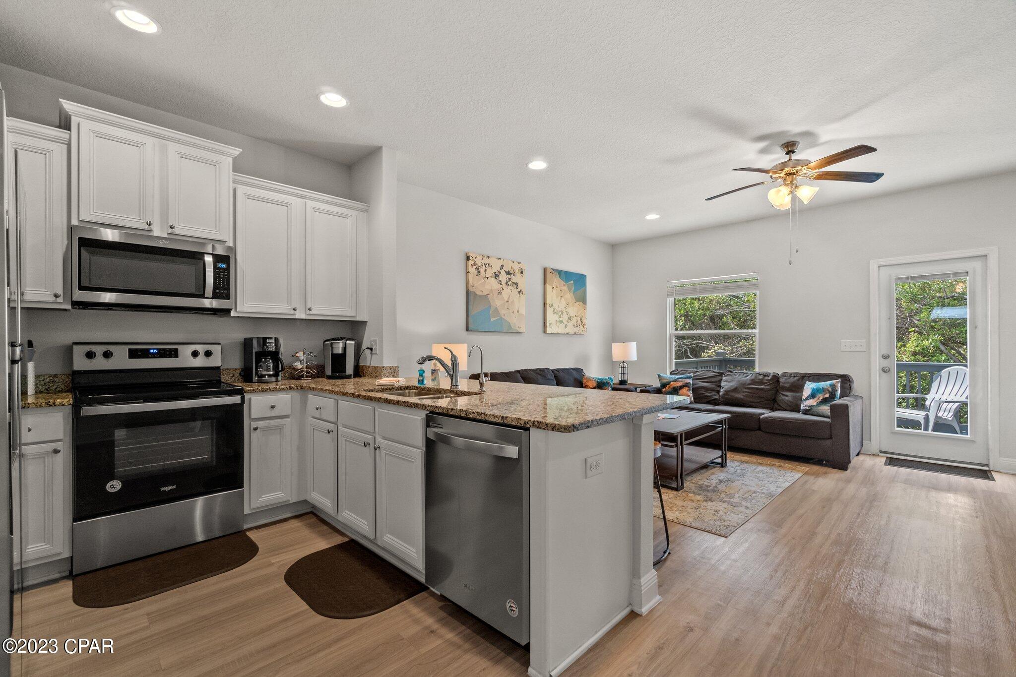 CURRENTLY UNDER CONTRACT, SELLER WILL CONSIDER BACKUP OFFERS The home is across from the gated pool with beautiful view if the pond. Great location close to the beach, easy access to HWY 98, Navy base, Sports Complex, grocery stores, night life and more. As you enter you have beautiful luxury vinyl plank flooring, granite countertops in the kitchen with SS appliances and all baths. Upstairs you have a master bedroom with a walk-in closet, shower, double vanity and a Beautiful View of the Pond. A smart home package is included with skybell doorbell camera, touch panel and KwikSet key-less entry. 2 Driveway spaces + 1 car garage. It will be a perfect primary residence, second home or vacation rental! Low HOA that includes ground keeping, outside insurance, pool, accounting, trash pick up, and maintenance of the common areas.