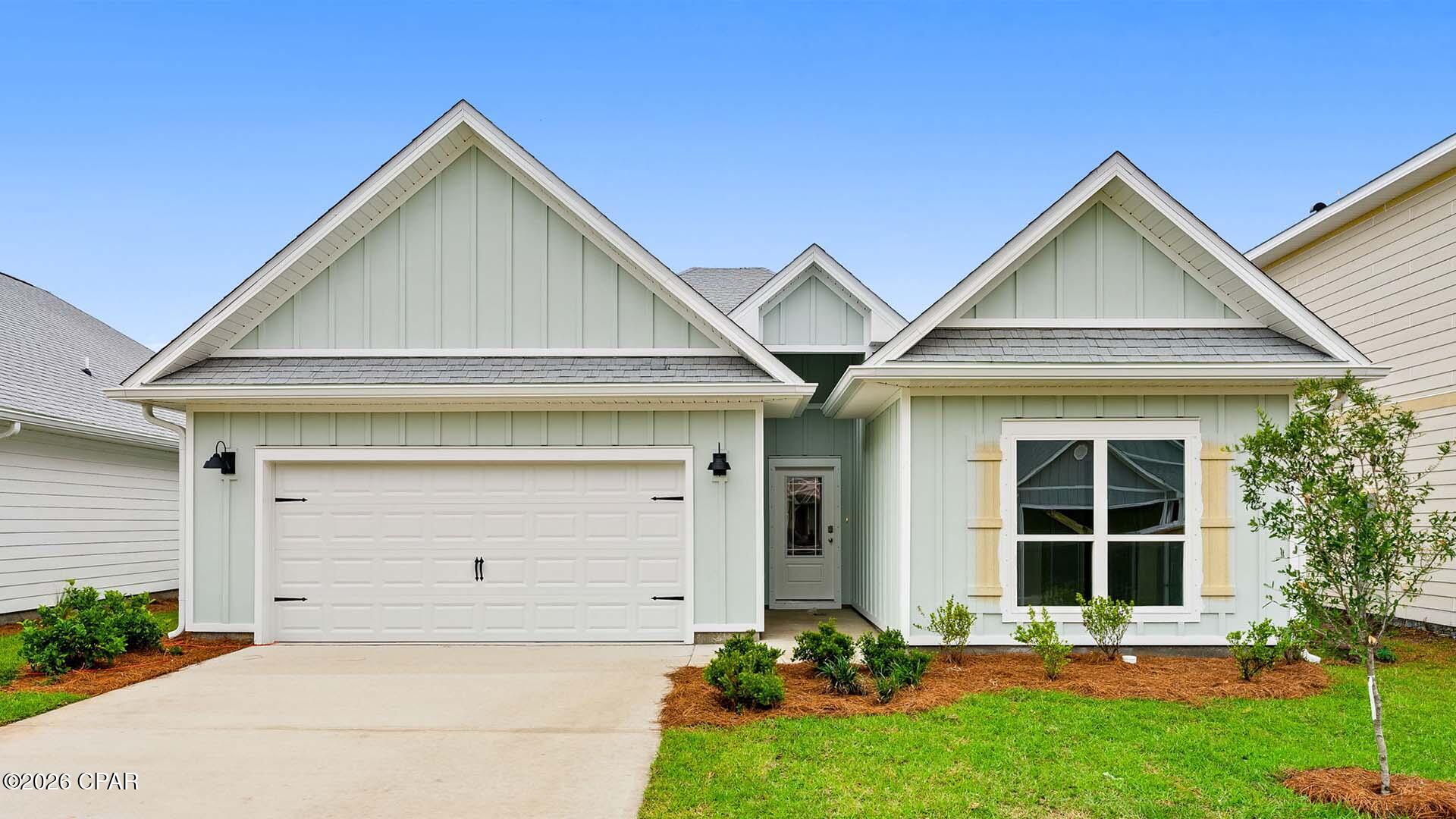 Welcome to 590 Hancock Way at Bayside at Ward in Panama City Beach, Florida. This home is ready for move in and features the Kennedy floor plan. It has five bedrooms and three full bathrooms. As you enter the home, you will pass a hall leading to two guest bedrooms which share a full bathroom. At the heart of the home, you will find a grand open concept living area, brightly lit by the many windows and glass back door. The kitchen has a center island that looks out to the spacious living area and dining room. Modern features include quartz countertops, EVP flooring throughout the home and standard appliances include a stove, microwave and dishwasher. The kitchen also has a pantry and upper and lower cabinetry for storage.

Nestled at the back of the home is a secluded hallway which holds the primary bedroom and an adjacent laundry room. The ensuite bathroom features a soak tub, a separate shower, a dual sink vanity with quartz countertops and lower cabinetry and drawers for storage. For your wardrobe, a large closet is in the primary bathroom as well as a separate water closet for privacy. There are two additional guest bedrooms and a shared bathroom off the dining room. Outside you will find a Hardie® siding exterior, a landscaped front entry and a two-car garage with remote access. Call us today for more information on this home.