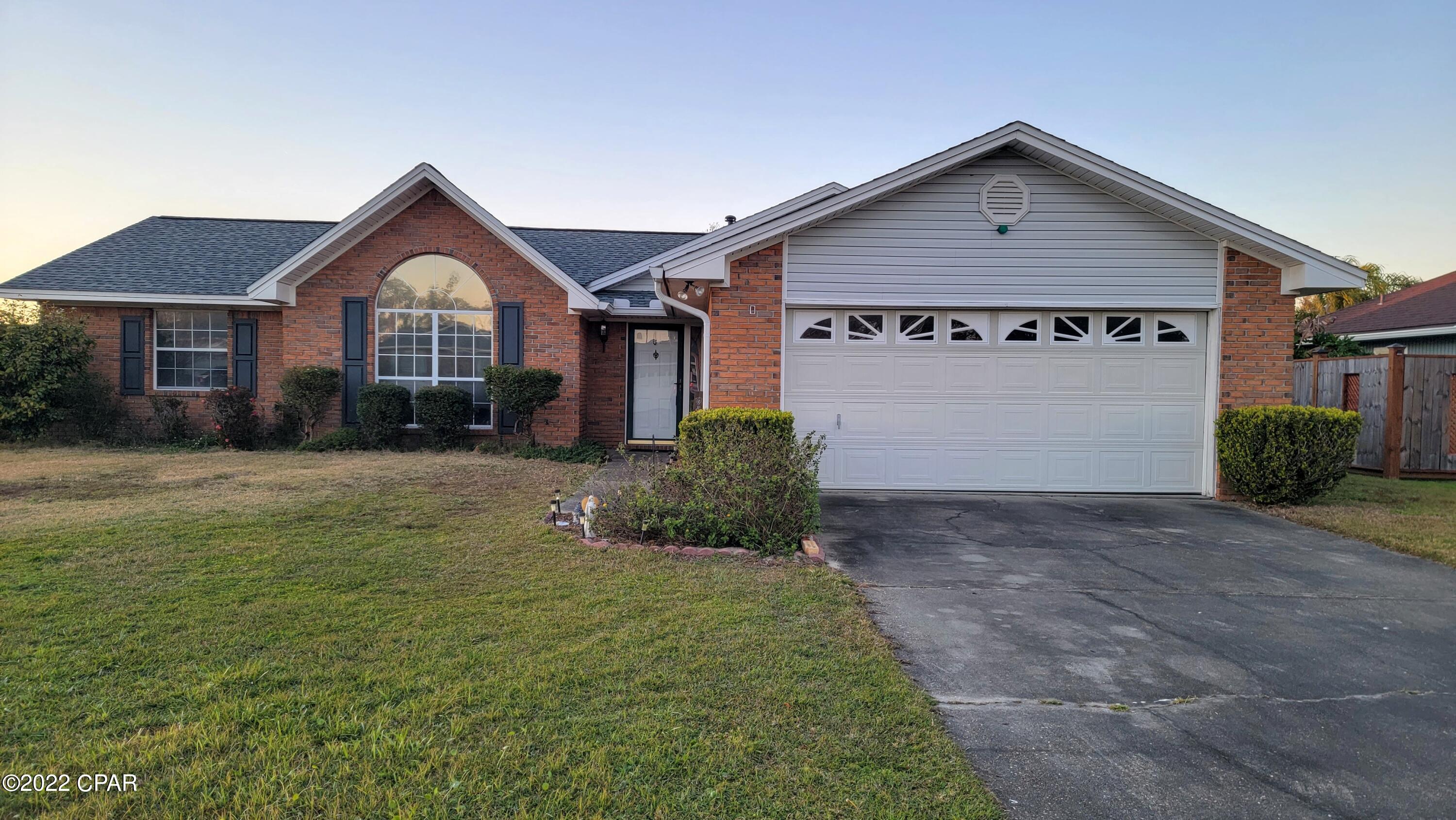 Well maintained home (original owner) near Tyndall AFB, shopping, etc.   This home suffered very minor damage from Hurricane Michael, but received a new roof, and new indoor/outdoor carpet in the heated and cooled sunroom.  This home has a spacious living room and nicely sized bedrooms,  The kitchen is just off the living area, and straight in from the garage so it's convenient for unloading.  Large lot with fenced back yard and a beautiful pond next door with walking area and benches.