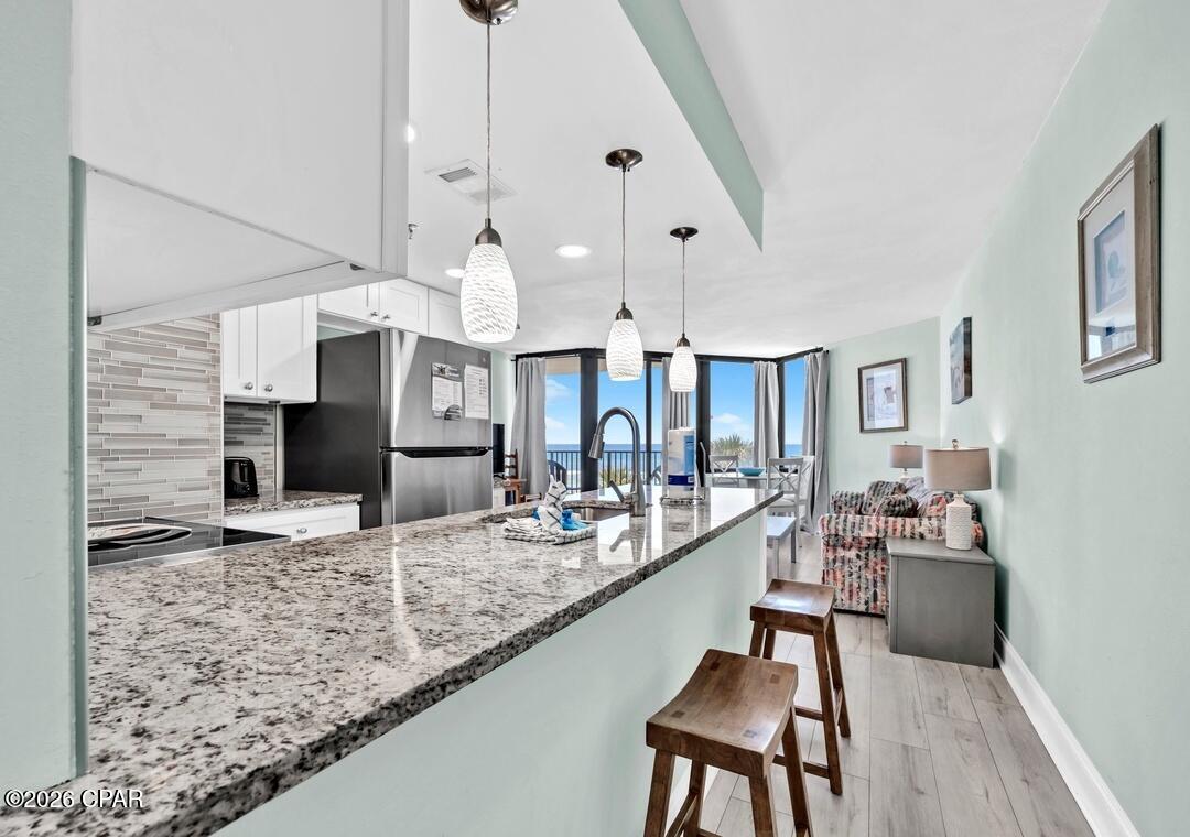 Welcome to a refined Gulf-front retreat in the heart of Panama City Beach--where elevated coastal living meets effortless luxury at Sunbird Resort #309E.

Top Reasons to OWN This Exceptional Gulf-Front Condo:

• Newly renovated with a private Gulf-front balcony showcasing sweeping pool and emerald gulf waterfront views! 
• Designed for intimate getaways or upscale small-family retreats
• Boutique low-rise beachfront community offering a more exclusive feel
• Three shimmering Gulf-front pools just steps from the sand
• Onsite fitness center and convenient community laundry
• Prime location next to the iconic Pineapple Willy's


Step inside to an open-concept layout adorned with designer furnishings and curated coastal finishes. The gourmet kitchen is a true showpiece, featuring stainless steel appliances, endless granite countertops, and a custom backsplash that elevates every culinary moment. The spa-inspired bathroom offers a luxurious glass-enclosed shower--crafted for indulgence after sun-soaked beach days.

Wake each morning to the glow of the Gulf and unwind each evening with breathtaking sunset views from your private balcony. This residence comfortably accommodates four guests with a serene queen suite and a stylish sleeper sofa, blending comfort with sophistication.

Sunbird Resort delivers a premier beachfront lifestyle with resort-style amenities, walkable dining, and direct access to sugar-white sands. Whether you're seeking a personal escape or a high-performing investment, this Gulf-front gem captures the essence of elevated coastal living.