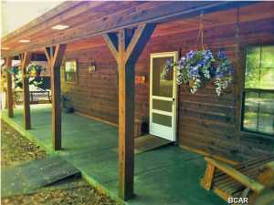 /*/*/*/*/ 2.4 ACRES w/ POND and CREEK /*/*/*/*/ HANDICAP ACCESSIBLE /*/*/*/*/ Massive outside deck overlooking wooded backyard. In view from there is your Nature Walk Bridge that runs next to the Creek. Also, you have your own spring fed pond, fully-stocked with BASS and BREAM, and has a screened-in Gazebo next to it./*/*/*/*/Huge floor-to-ceiling stone Fireplace, Hardwood Floors, beautiful Wood Cabinets in Kitchen. Many more feautures as well.