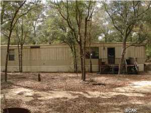 20 acres in the Fountain area with a 3BR/2BA mobile home on the property. There is a creek that runs through the back of the property. This would make a great weekend retreat/hunting lodge. All info is approx. and must be verified by Buyers if important.