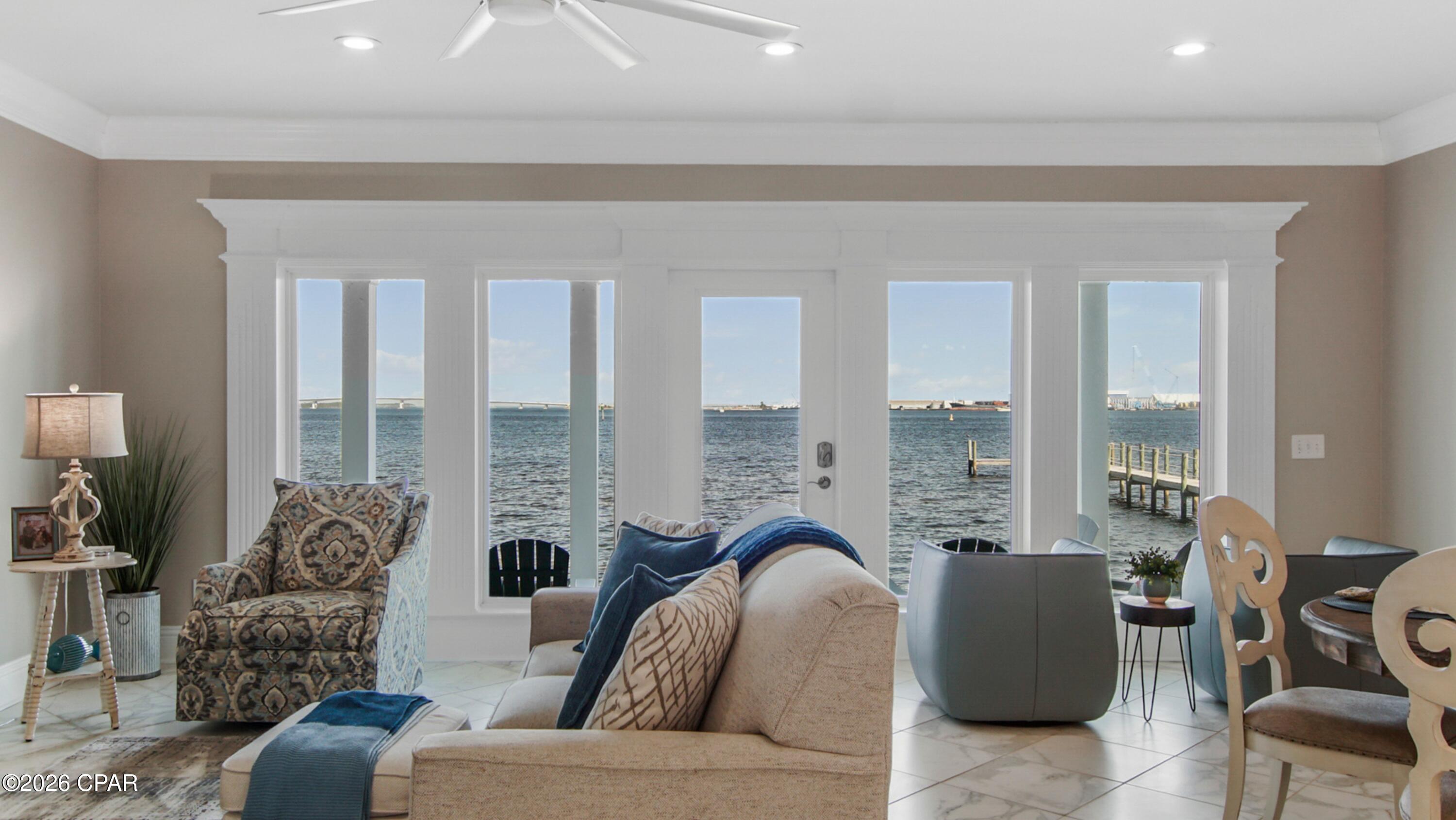 Welcome to your dream waterfront retreat in the Pelican Bay community on St. Andrews Bay!
This stunning townhome features 3 spacious bedrooms and 2.5 bathrooms, offering a generous 2,357 square feet of luxurious living space. The open-concept layout is bathed in natural light, with 9 ft ceilings and large windows framing breathtaking views of the bay. Stylish shiplap and board and batten accents add a touch of charm and character throughout this home. 
This stunning kitchen is complete with stainless steel appliances, farmhouse sink, ample cabinetry and includes convenient breakfast bar. Beautiful tile adorns the backsplash in the kitchen and the flooring throughout this home. The master suite serves as a serene sanctuary, boasting a spacious walk-in closet and an en-suite bathroom equipped with a soaking tub, his/her vanity, and separate shower.

Step outside to your private balcony, perfect for enjoying the sunrise with your morning coffee. In addition to the exquisite interior, this townhome provides access to community amenities, including two private docks, swimming pool and hot tub. Or enjoy a stroll along Nature Walk in the 7 acre preserve. 
Located near pristine beaches, shopping, dining, and entertainment options, you can easily indulge in various water activities like boating, fishing, and kayaking right from your backyard. 
Photos do not capture the beauty of this home. It's a must see! Don't miss this opportunity to own a piece of paradise in Pelican Bay!