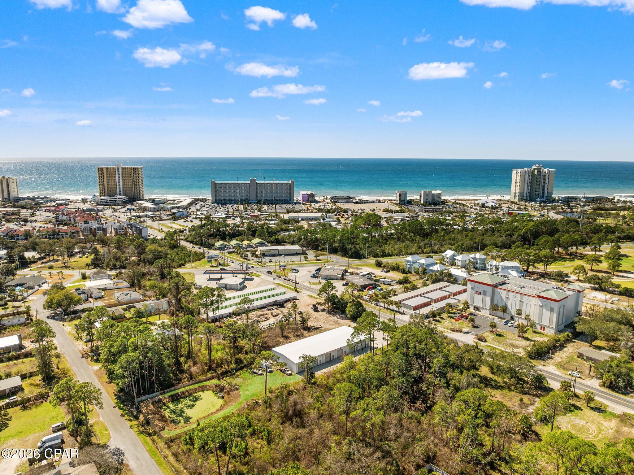 FUTURE-PROOF PCB ASSET: 9,000 SF 2022-BUILD WITH 10-STORY VERTICAL POTENTIAL

Seize a premier 0.998-acre commercial footprint on Joan Avenue, positioned directly in a high-growth corridor evidenced by a neighboring property trading for $15.4M last year. Built in 2022 to rigorous 140 MPH wind standards, this high-spec complex features 100 feet of prime street frontage and a deep 435-foot lot. The property carries a rare 100-foot height allowance, offering massive potential for future vertical expansion.

MAXIMIZED RENTAL POTENTIAL: TURNKEY 6-UNIT INVESTMENT CONFIGURATION

This 60' x 150' engineered steel facility is a ''plug-and-play'' multi-tenant opportunity designed to maximize your ROI. The current layout is optimized for high-demand flex use, with the first section serving as 2 premium executive offices, lobby, a conference room and public bathroom. While the building already features five sections ready for separation, a small investment of approximately $10,000-$12,000 allows for the addition of two walls and four bathrooms to complete the full 6-unit complex. With two bathrooms already existing and plumbing stubs in place for the remaining four, this property offers a low-cost path to a high-yield, multi-stream rental asset.

INDUSTRIAL UTILITY: 53-FOOT TRAILER ACCESS AND 6-GANG POWER

Loading is seamless via six 12 x 12 grade-level roll-up doors. Property footprint is designed to accommodate a 53-foot trailer. The 9,000 SF shell maintains an efficient ratio of 8% office to 92% warehouse space, with interior clear heights ranging from 13'7'' to 16'11''. The facility is equipped with a 6-gang electrical meter bank and 600 Amp single-phase power, providing dedicated service points for each of the six potential rental units. The front office has 200 amp service.

UNINCORPORATED BAY COUNTY LOCATION: LOWER TAXES AND FEWER RESTRICTIONS

Located in Unincorporated Bay County rather than city limits, this property offers a strategic financial advantage with lower property tax rates, set at 5.4362 mills for 2026. Owners benefit from fewer municipal restrictions regarding signage or ''Gateway Overlay'' facade requirements. Standard county setbacks apply here, offering significantly more buildable flexibility than properties bordering strict city-residential zones.

STRATEGIC PRICING: ENGINEERED FOR SAFETY AND PROFIT

At a listing price of $2.5M, this asset is positioned at approximately $277 per SF, strategically aligned with the early 2026 PCB flex-industrial average of $290-$310 per SF. The property is located in Flood Zone AE with a community-determined base flood elevation (BFE) of 11.0'. Highlighting its superior engineering, the finished floor elevation is set at 12.75', providing 1 foot 9 inches of clearance above the required BFE for enhanced safety and insurance advantages.

Buyer to verify height allowance, ISR, and FAR for future development. Current tenant occupies 1500 sq ft and on a month to month lease.