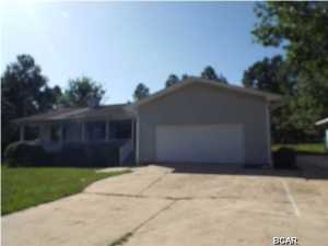 REDUCED!!! Contemporary three bedroom two bathroom home in move-in condition on nice lot of 1.04 Acres offered as is. The property has a full length front porch with swing, nice rear deck with chain link fencing. The property features a detached work shop/storage building. The Kitchen has new appliances. The property is a split floor plan with alarm system. All sizes are approximate please verify accordingly if important.