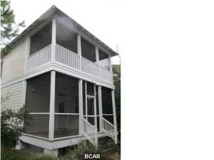 Barefoot Cottages - Bayside living in a gated community with turn key living at its best at a great price. Two pools, hot tub, playgrounds, grilling areas, community center with exercise equipment, grounds keeping and much more. Unit is complete with stainless appliances, hardwood floors downstairs and ready to go. Each bedroom has an en suite private bath and the upstairs master has its own screened in porch/balcony. You'll also enjoy the screened in porch downstairs off the living area. All dimensions taken from the Gulf County Property Appraiser's website and deemed reliable. **Buyer Rebate up to $2,000 on this unit. Some restrictions may apply.