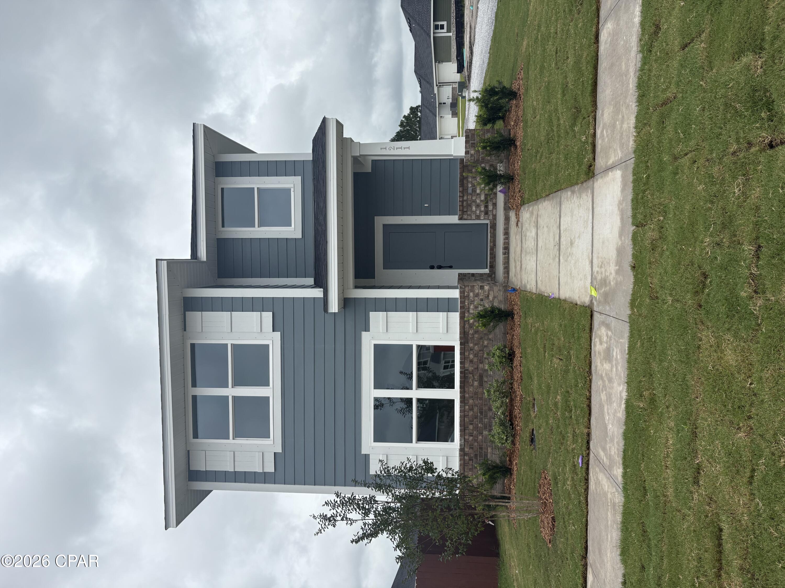WATERFRONT COMMUNITY! LIMITED OFFER: Get a tiered rate: 2.99% (Year 1), 3.99% (Year 2), then 4.99% fixed for life. PLUS MOVE IN PACKAGE INCLUDED &  COVERING CLOSING COST W/ PREFERRED LENDER!!! Experience the perfect blend of architectural character and functional luxury in this unique two-story residence. Designed with generous proportions in mind, the home features three spacious bedrooms--each boasting its own private full bathroom. The two upstairs suites are particularly expansive, bathed in natural light from large windows that frame stunning views of the bay. Outside, a lush side yard offers a private oasis, perfect for relaxation or entertaining.