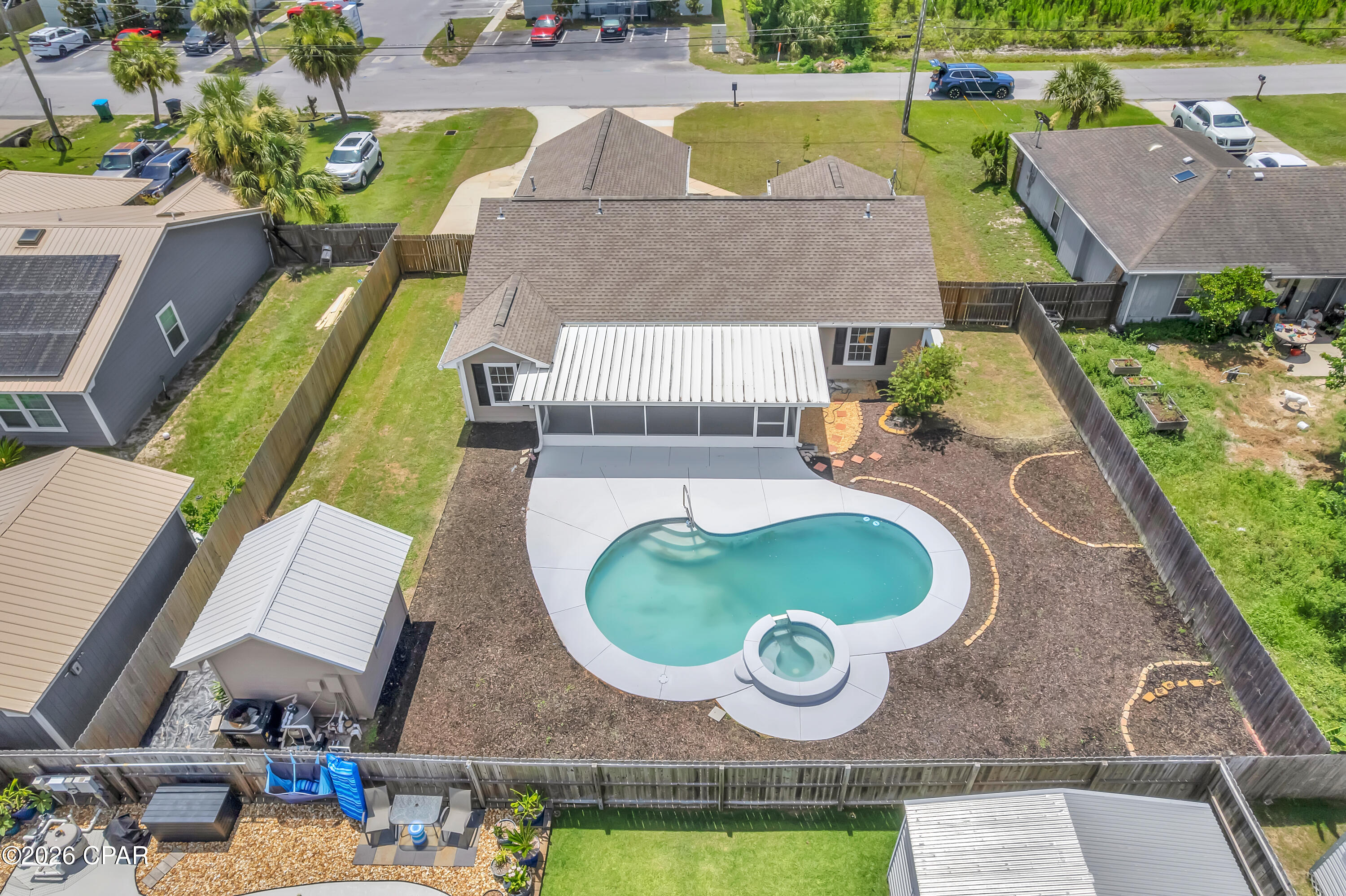 FRESH UPDATES. PRIVATE POOL. CLOSE TO TYNDALL. 1321 South Berthe Avenue in Panama City offers a well-cared-for three-bedroom, two-bathroom home near Callaway Point with a split floor plan, inviting outdoor space, and thoughtful updates throughout. Recent improvements include newly painted interior and exterior surfaces, brand-new carpet in the bedrooms, and LVP flooring throughout the main living areas.
Inside, the living room features a vaulted ceiling, a comfortable central layout, and two sets of French doors that open to the screened Florida room. The kitchen offers white shaker cabinetry, granite countertops, a gas stove, and a separate nook with a wine rack and hanging storage for wine glasses.
The primary suite includes a separate sitting area, a sliding glass door to the screened Florida room, a barn door leading to the bathroom, a vanity with ample storage, a walk-in closet, a tub/shower combination, and a private water closet. The guest bathroom features a walk-in tiled shower, and the hallway laundry area includes both gas and electric dryer connections.
Outdoor living is a major highlight, with a screened Florida room that includes a gas stub for compatible outdoor-rated equipment, including select outdoor grills, plus a kidney-shaped in-ground pool, a spacious yard, and a storage shed for tools and outdoor equipment. The property also includes side parking suitable for a boat, a double-car garage, a whole-house generator, and sprinklers on well water with a fertilizer injector.
With fresh paint, new carpet, a private pool, and a location close to Tyndall Air Force Base, 1321 S. Berthe Avenue brings together comfort, convenience, and easy days near Callaway Point.