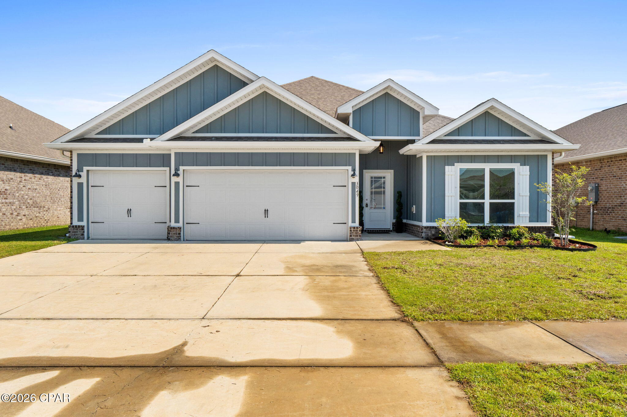 This stunning 2023-built Craftsman-style home nestled in the highly sought-after Hodges Bayou subdivision. Offering 2,301 square feet of thoughtfully designed living space, this exceptional residence features 4 bedrooms, 3 full bathrooms, and the perfect blend of modern elegance, functionality, and everyday comfort.

Step inside to discover an open-concept floor plan highlighted by soaring tray ceilings in the spacious living room, abundant natural light, and high-end finishes throughout. The beautifully appointed kitchen comes complete with a brand-new refrigerator, ample cabinetry, built in oven, and a seamless flow into the main living and dining areas--perfect for entertaining or family gatherings.

The private owner's suite is a true retreat, featuring a luxurious ensuite bathroom with a walk-in tiled shower, relaxing soaking tub, dual vanities, and a spacious walk-in closet. Most of the interior has been freshly painted, giving the home a crisp, move-in-ready feel.

Enjoy Florida living year-round from the screened-in back patio, overlooking the fully fenced backyard--ideal for children, pets, outdoor entertaining, or simply relaxing in complete privacy.

Located in the desirable Hodges Bayou community of Southport, you'll enjoy a peaceful setting while remaining just minutes from shopping, dining, schools, parks, and all that Panama City has to offer.

This nearly new home offers the rare opportunity to enjoy modern construction, luxurious finishes, and a prime location--all without the wait of building. Schedule your private showing today.